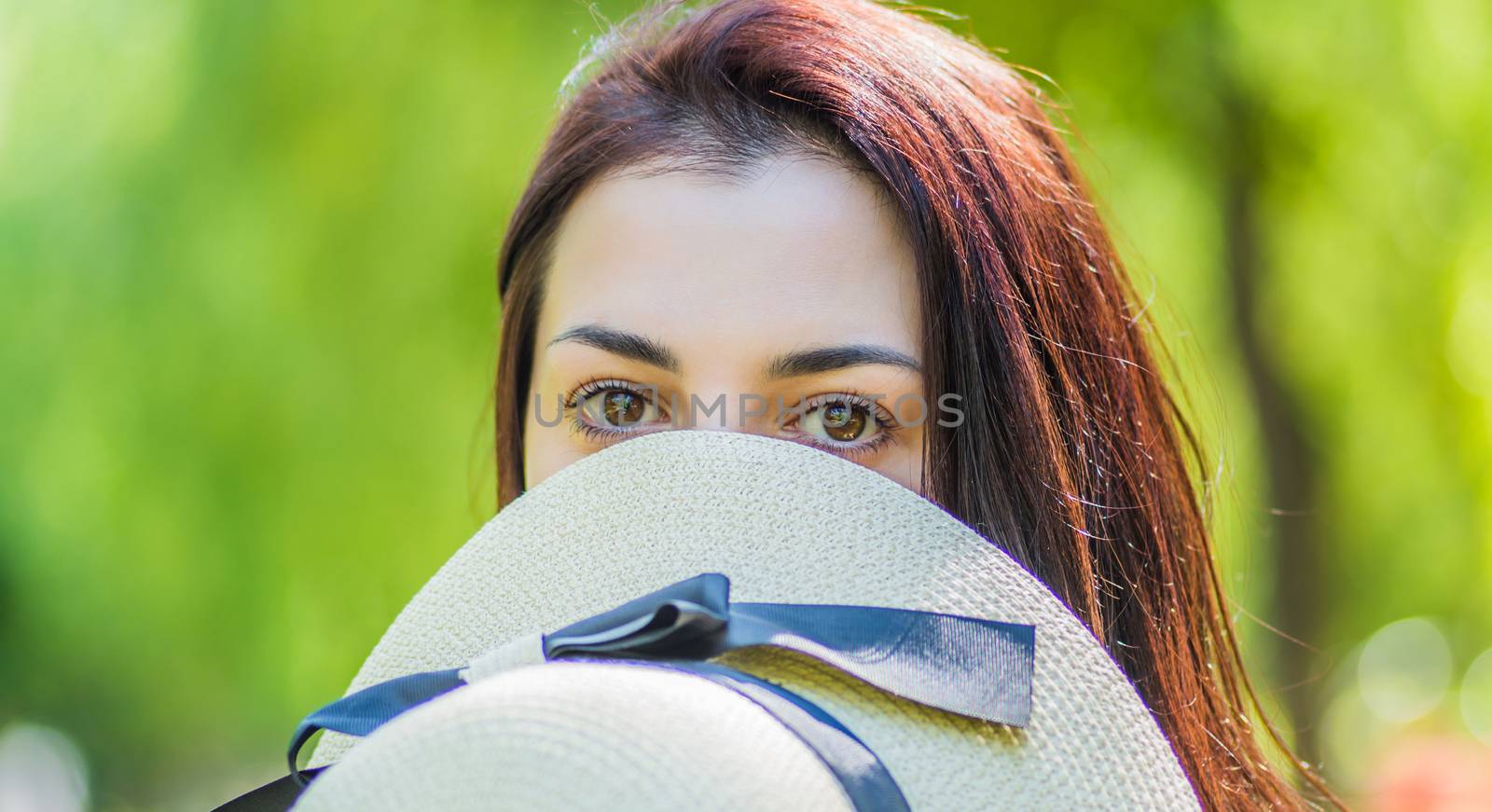 woman face with perfect skin covered with a hat by Desperada