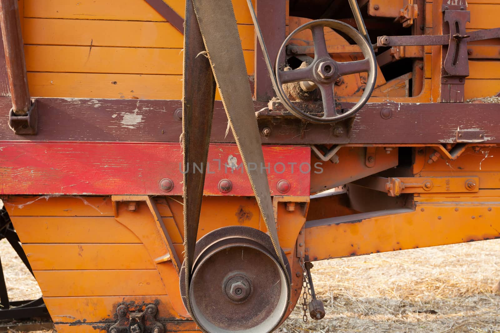 Close up of the pulleys of an old agricultural vehicle, rural life