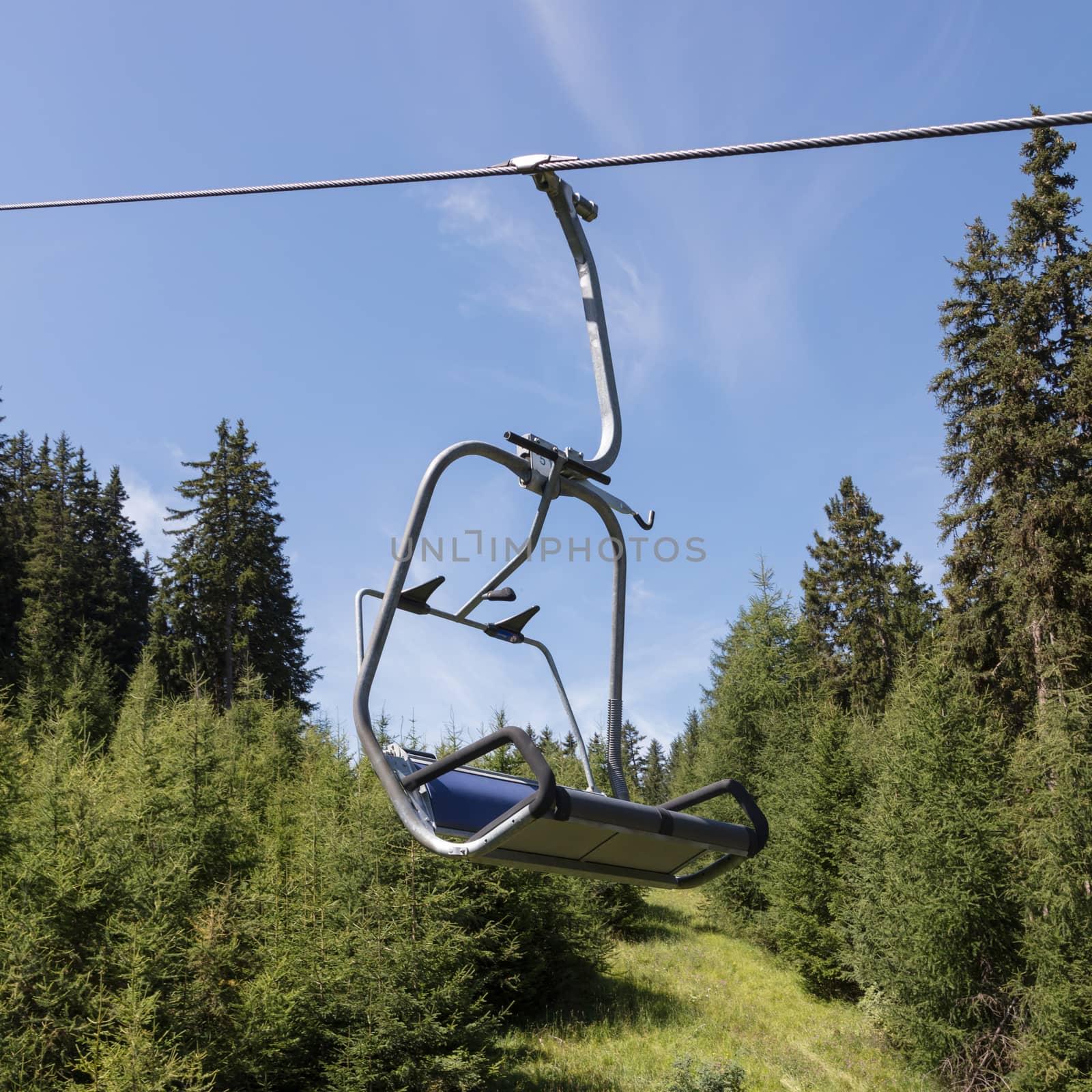 Ski lift chair in the Alps by michaklootwijk