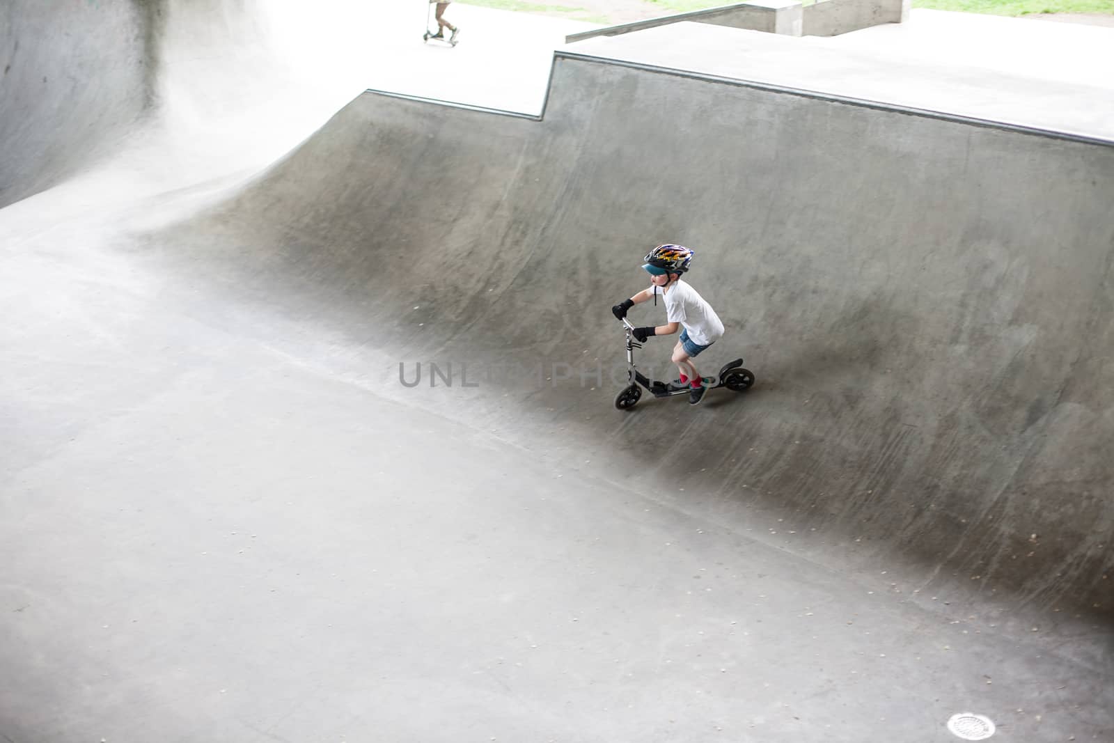 Powerful funny young guys are trained in a skate park Stockholm, Sweden. Leisure, playing, trick