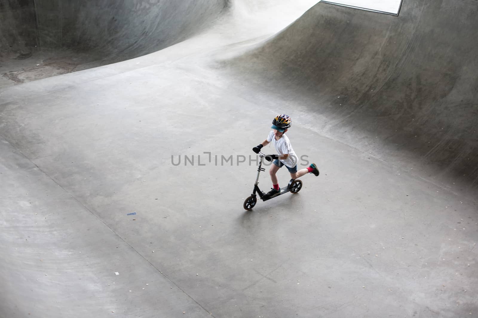 Powerful funny young guys are trained in a skate park Stockholm, Sweden. Leisure, playing, trick