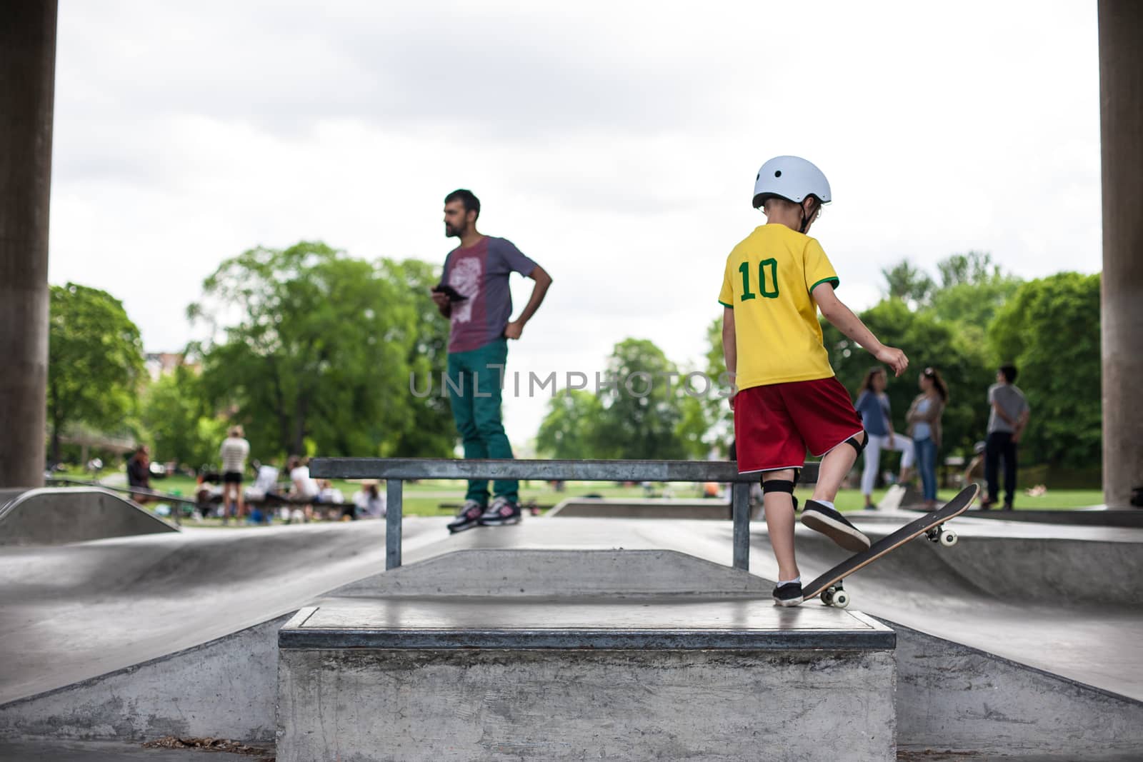 Powerful funny young guys are trained in a skate park Stockholm, Sweden. Leisure, playing, trick