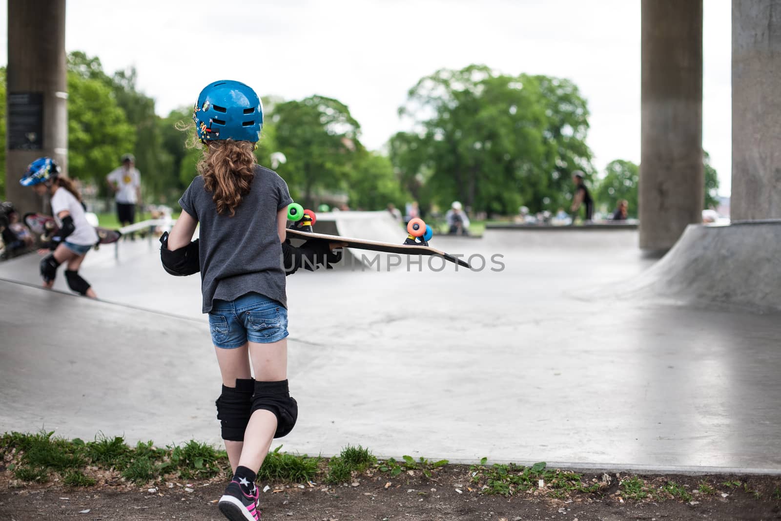 Powerful funny young guys are trained in a skate park Stockholm, Sweden. Leisure, playing, trick