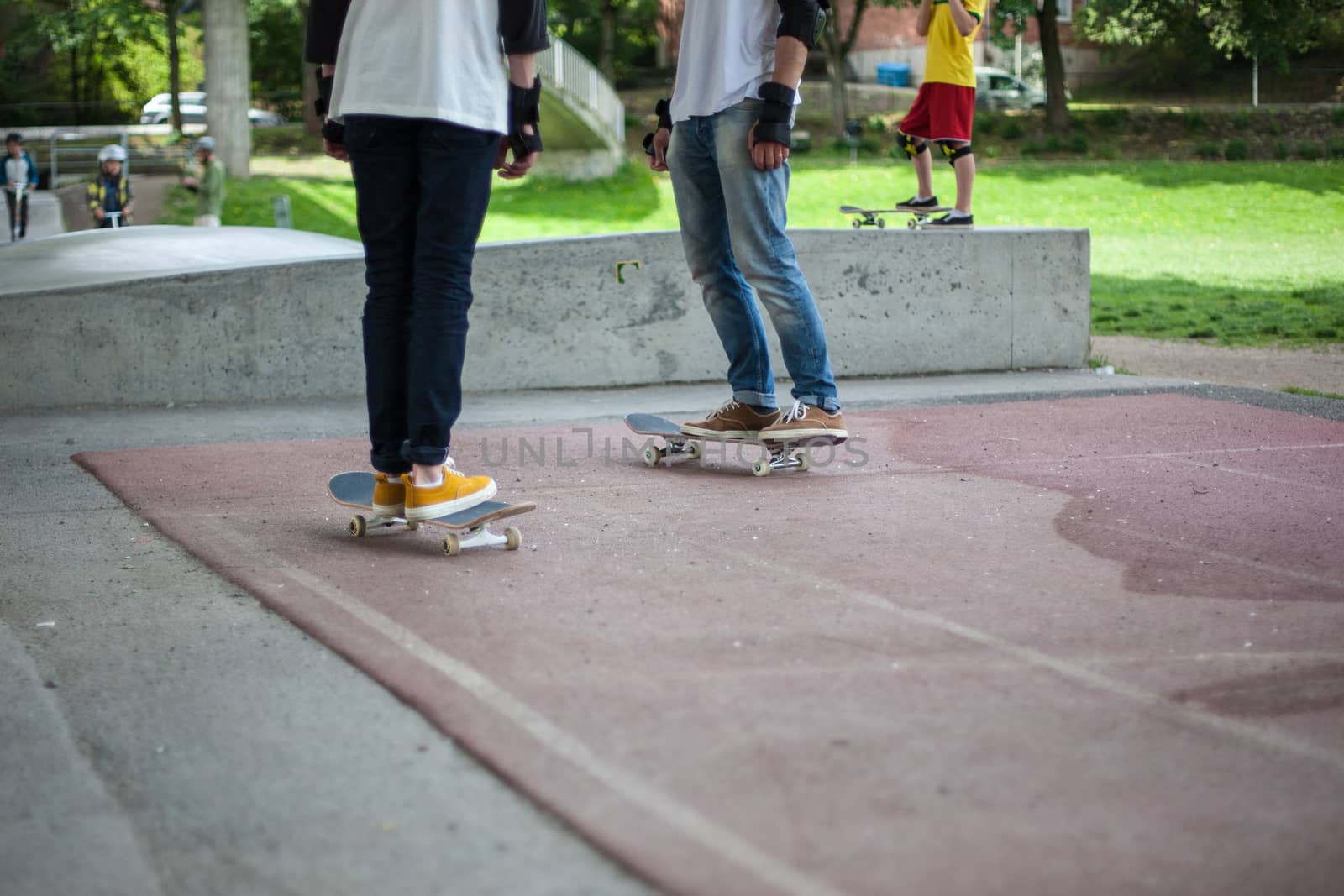 Powerful funny young guys are trained in a skate park Stockholm, Sweden. Leisure, playing, trick