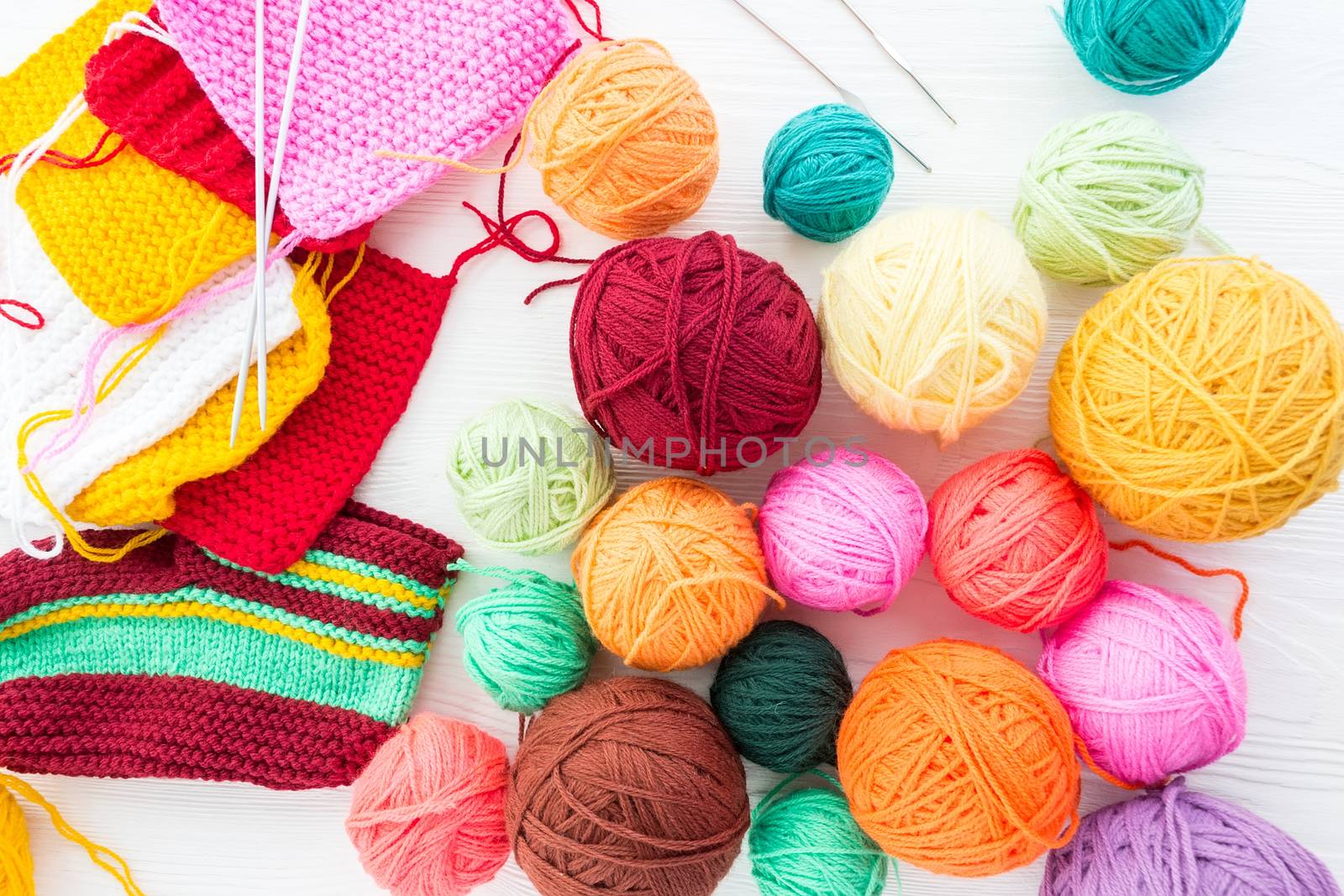 The photo shows the knitting needles with a ball