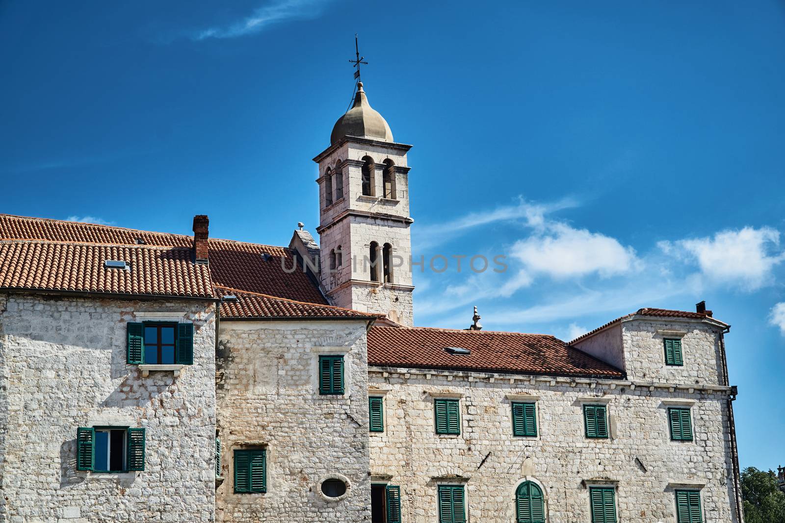 stone houses and church bell tower in the city of Sibenik in Croatia