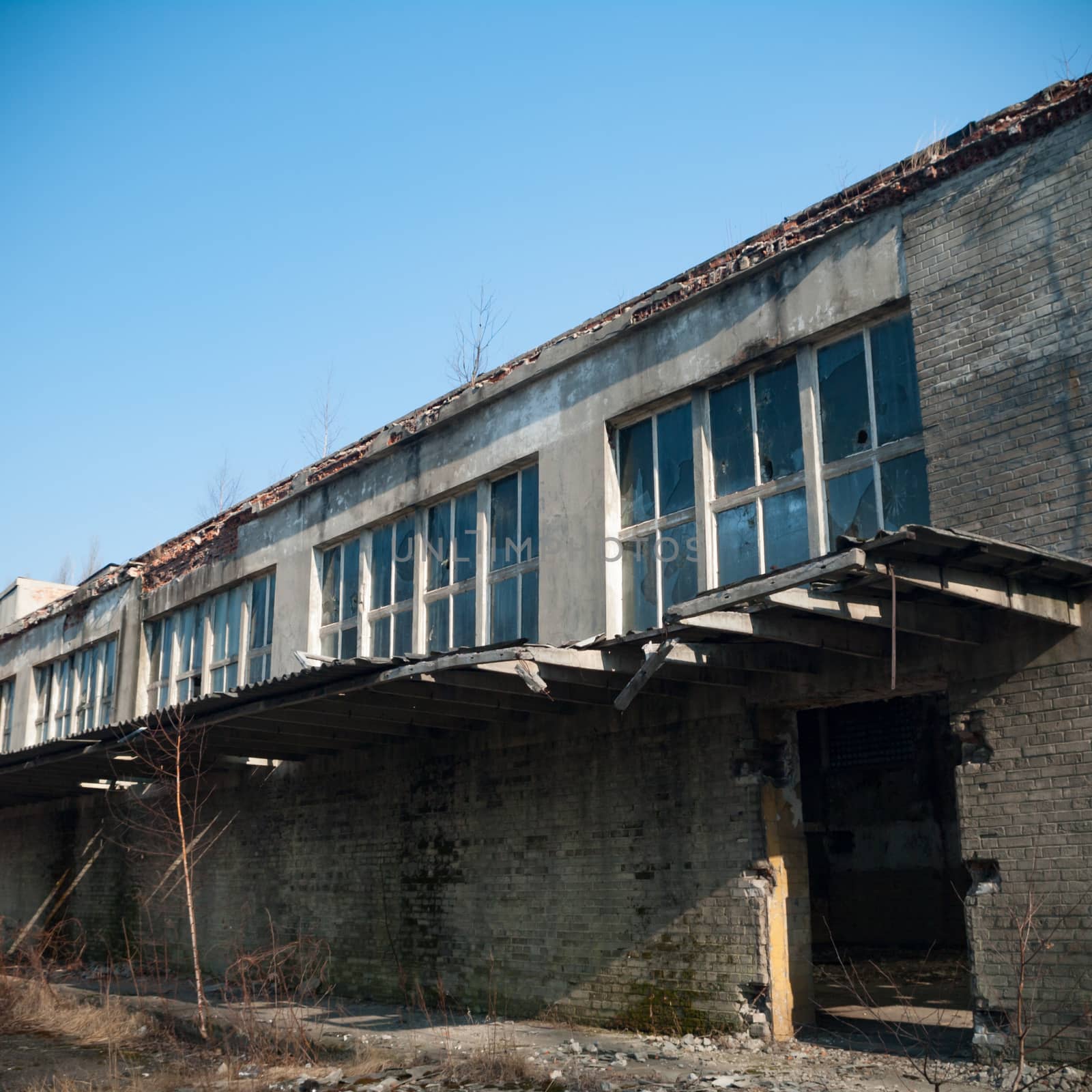 discarded ruin with old windows and wall, industrial window in concrete wall