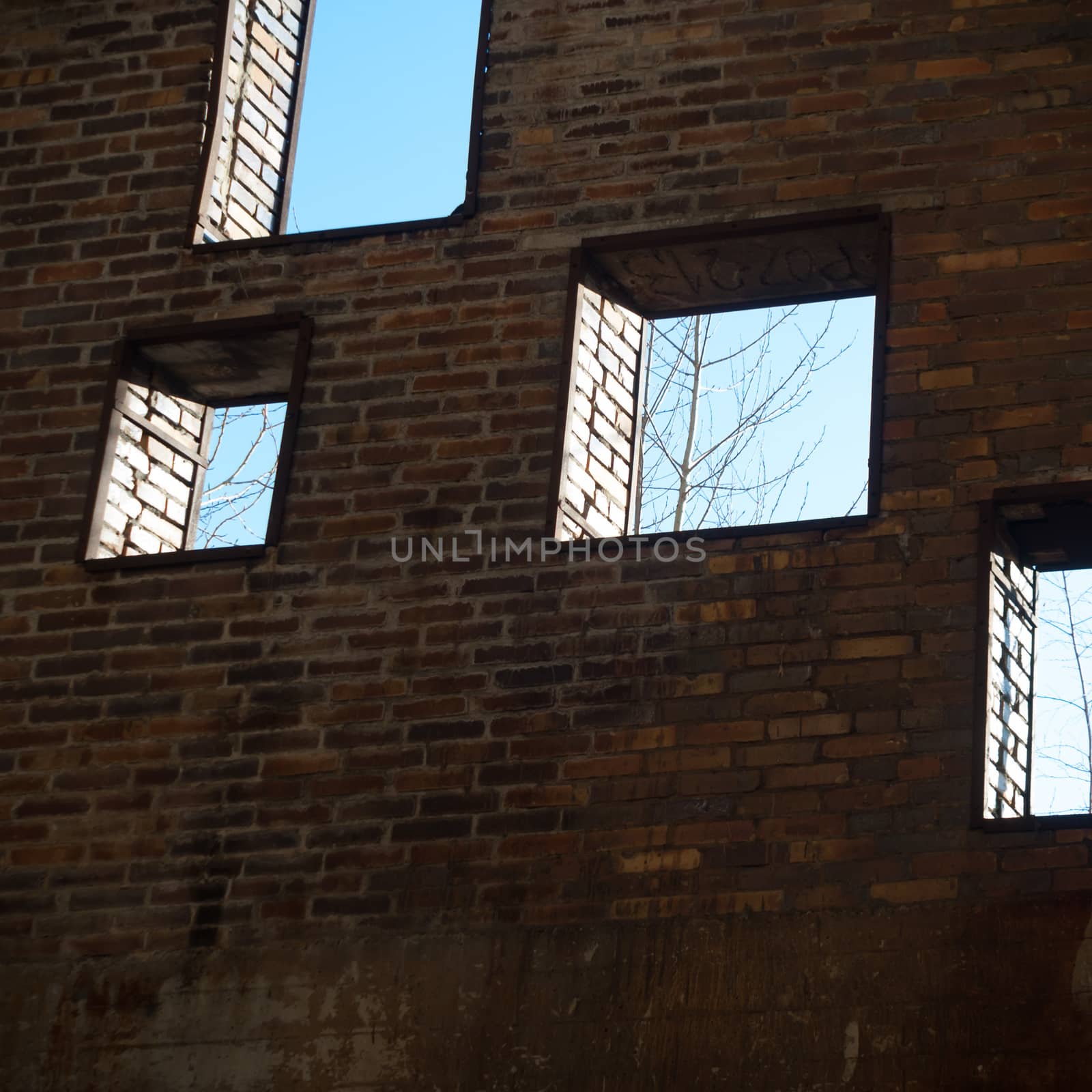 discarded ruin with old windows and wall, industrial window in concrete wall