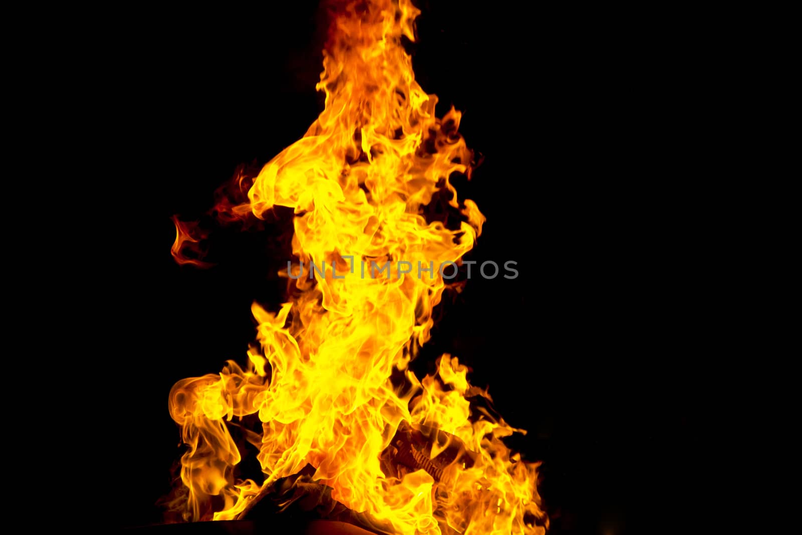 Photo of red fire flame on black background