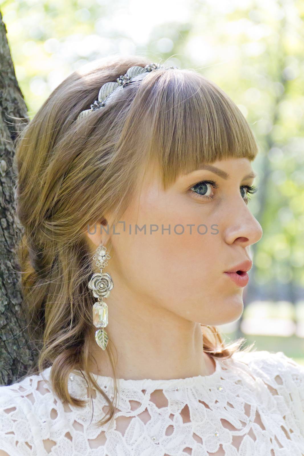 Beautiful talking bride with diadem in summer by Julialine