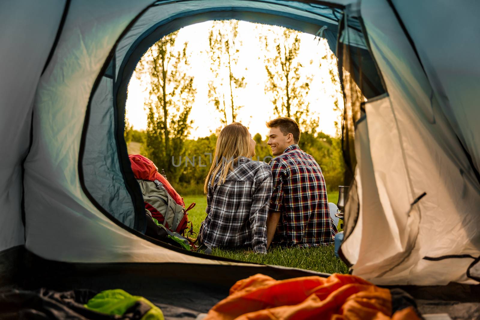 Shot of a happy couple camping on the nature