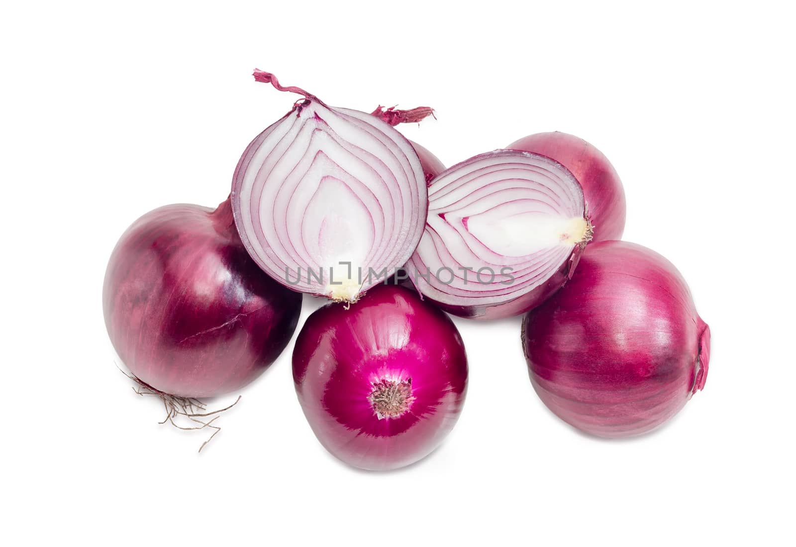 Several whole and one cut in half red onions on a white background
