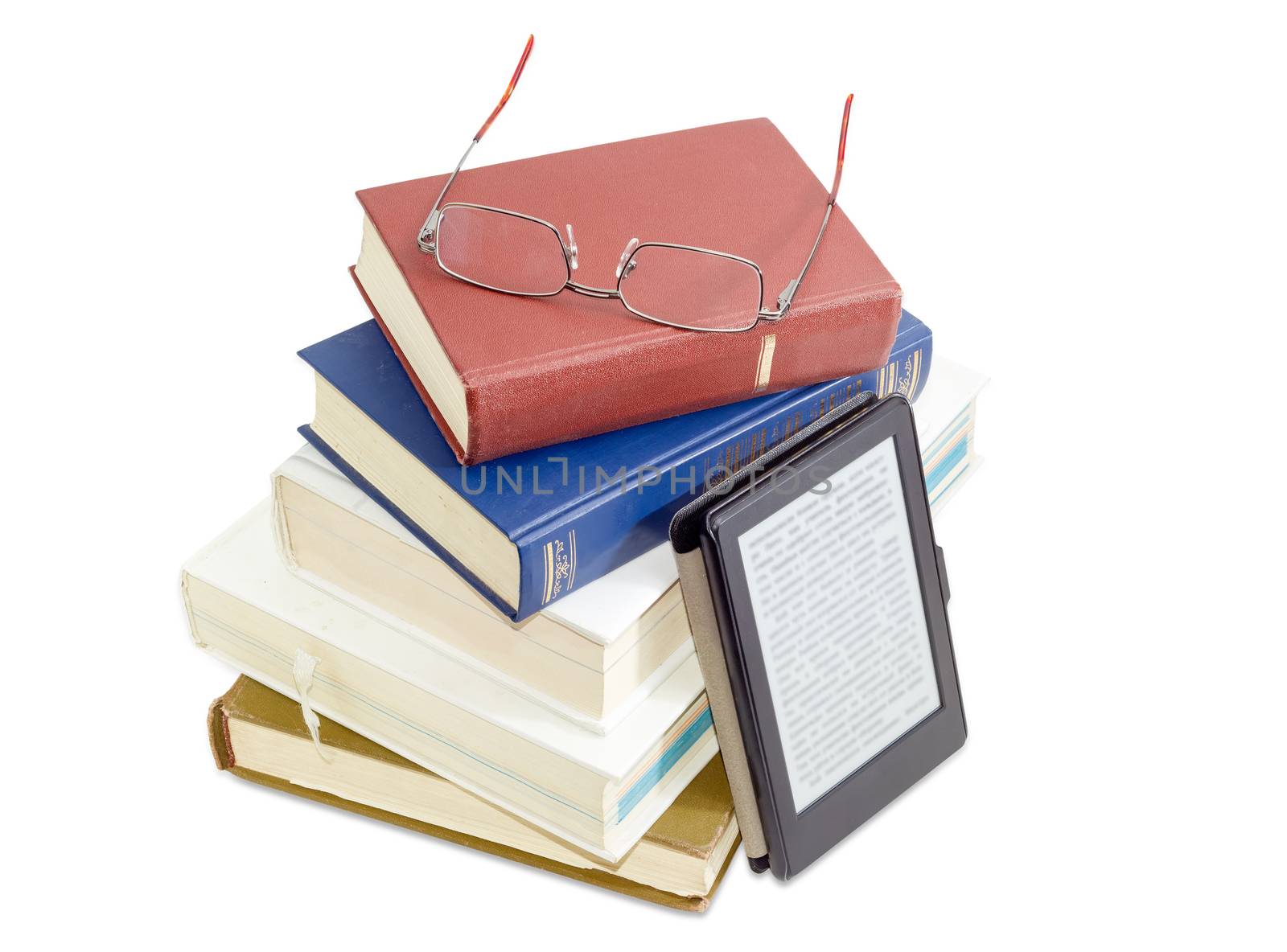 E-book reader beside of a stack of ordinary paper books and modern classic men's eyeglasses in metal frame on it on a white background
