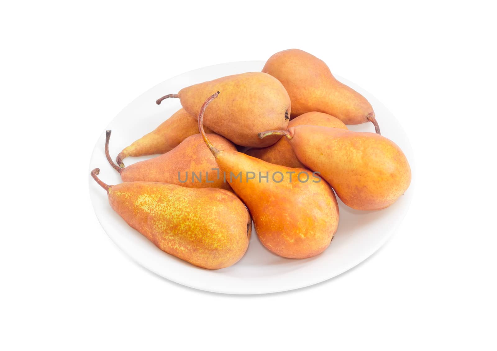Several ripe yellow and light brown European pears of autumn variety Bere Bosc on a white dish on a white background
