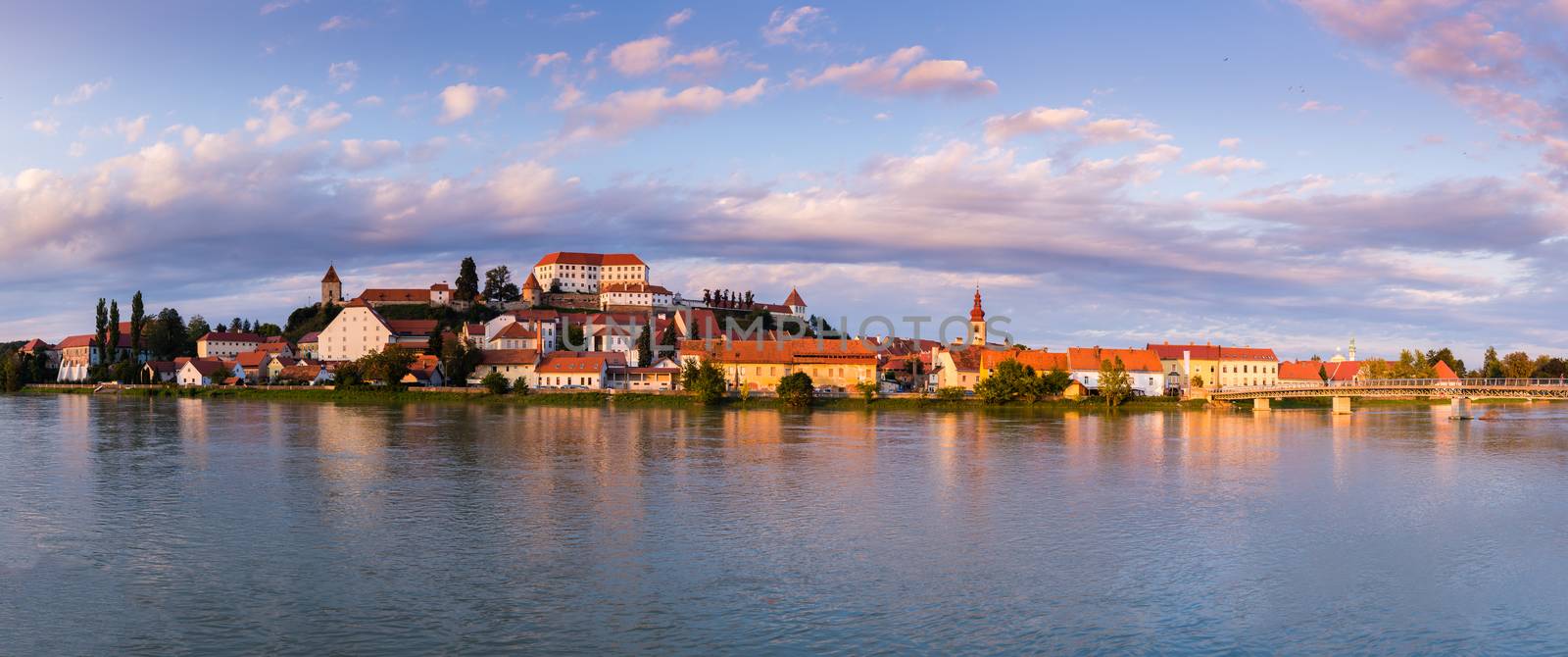 Ptuj, Slovenia, panoramic shot of oldest city in Slovenia with a castle overlooking the old town by asafaric