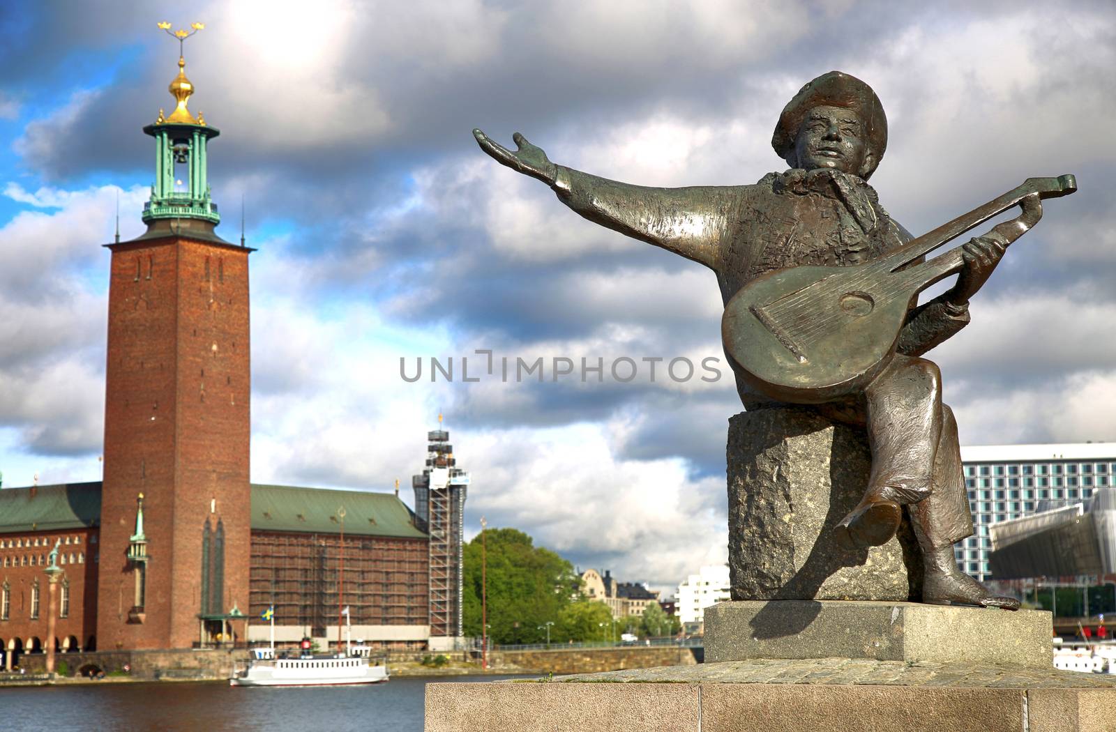 Evert Taube monument on Gamla Stan and City Hall in Stockholm, Sweden