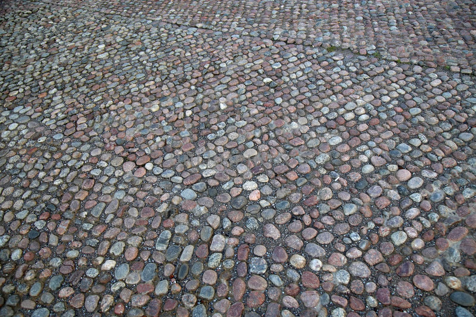  Cobblestone Pavement located on the Slottsbacken street near the Royal Palace in Stockholm, Sweden