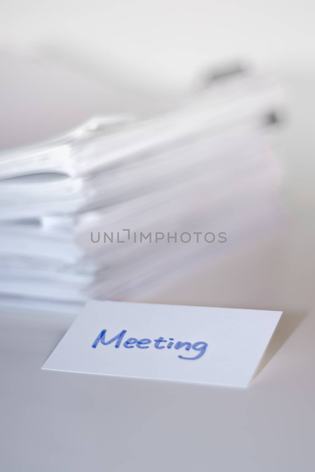 Meeting; Stack of Documents on white desk and Background.