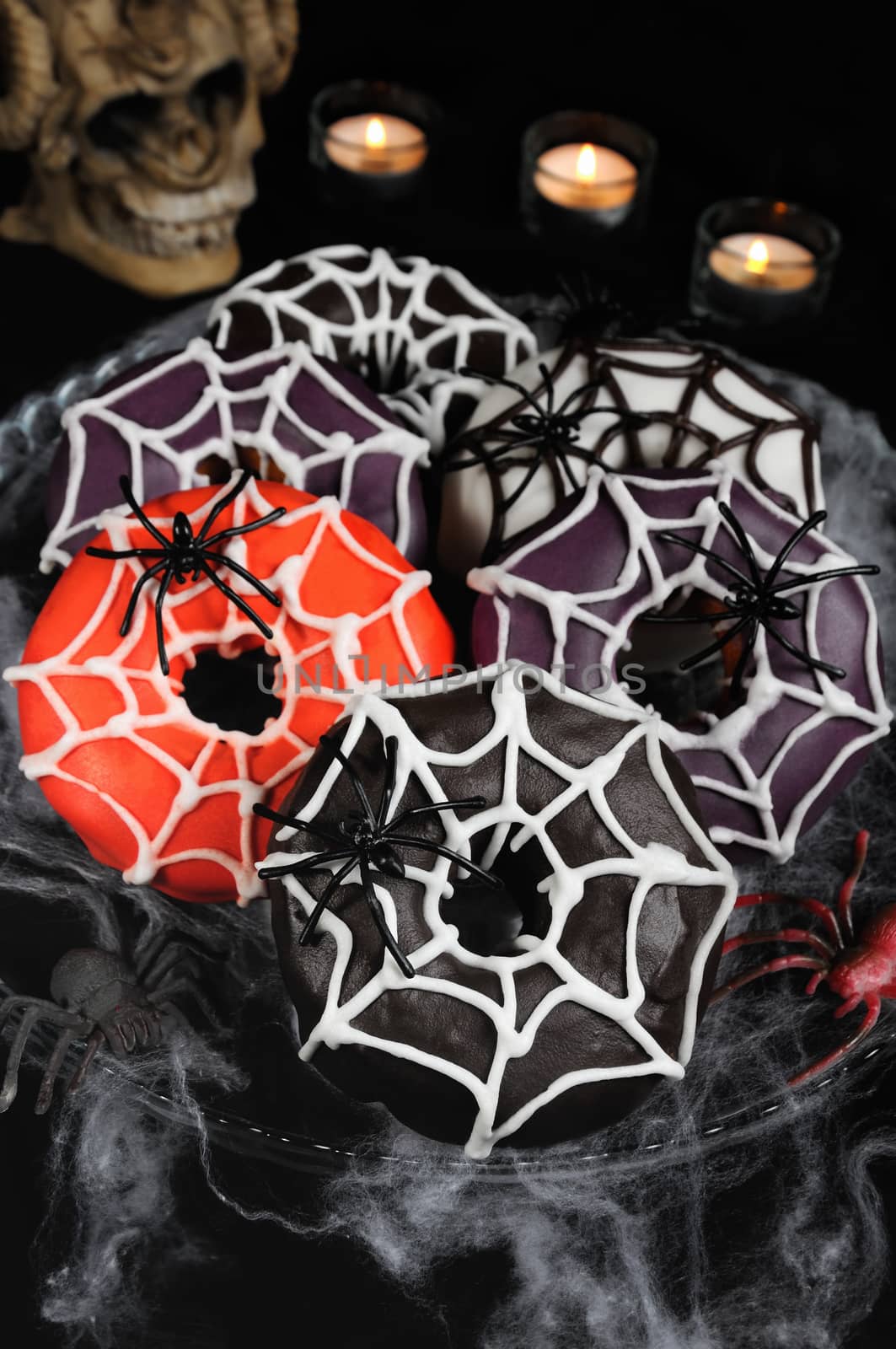 Glazed donuts decorated with cobwebs for Halloween