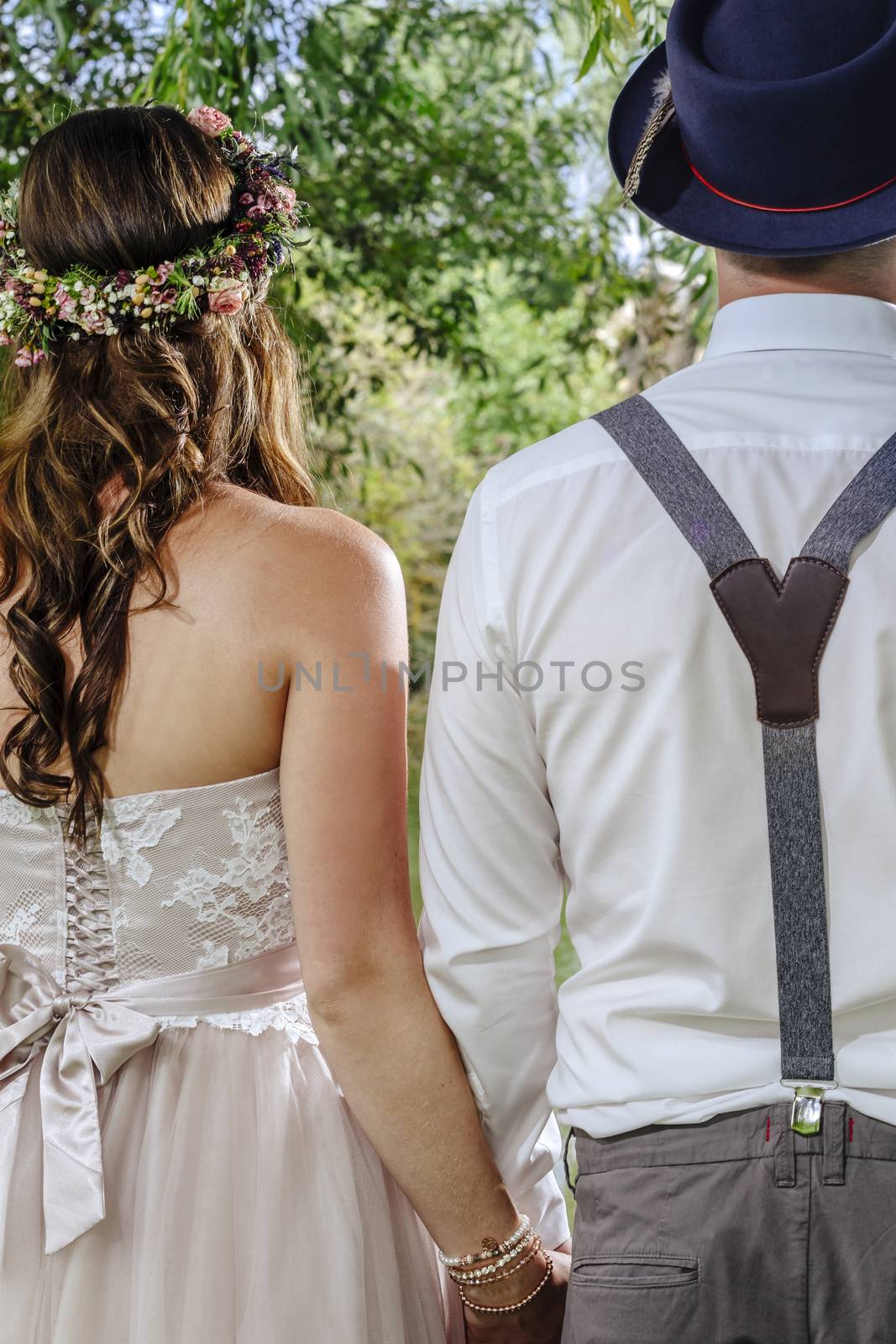 Cropped photo of a beautiful couple from behind on their wedding day.