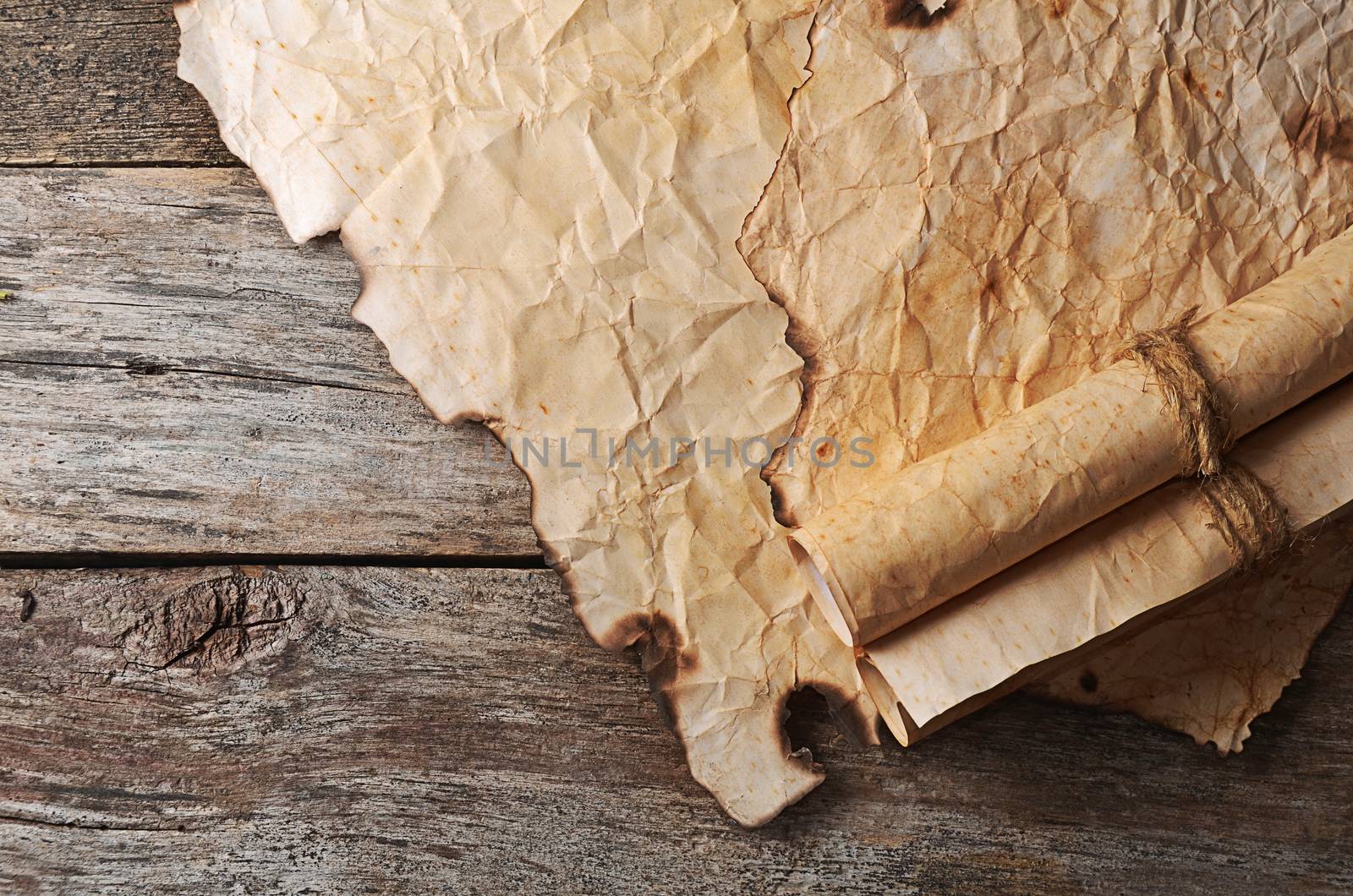 Old crushed paper with the burned edges