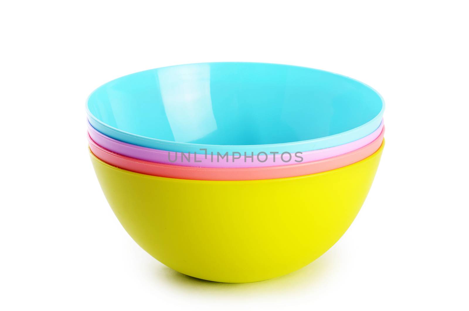 Plastic colorful plates isolated on white background