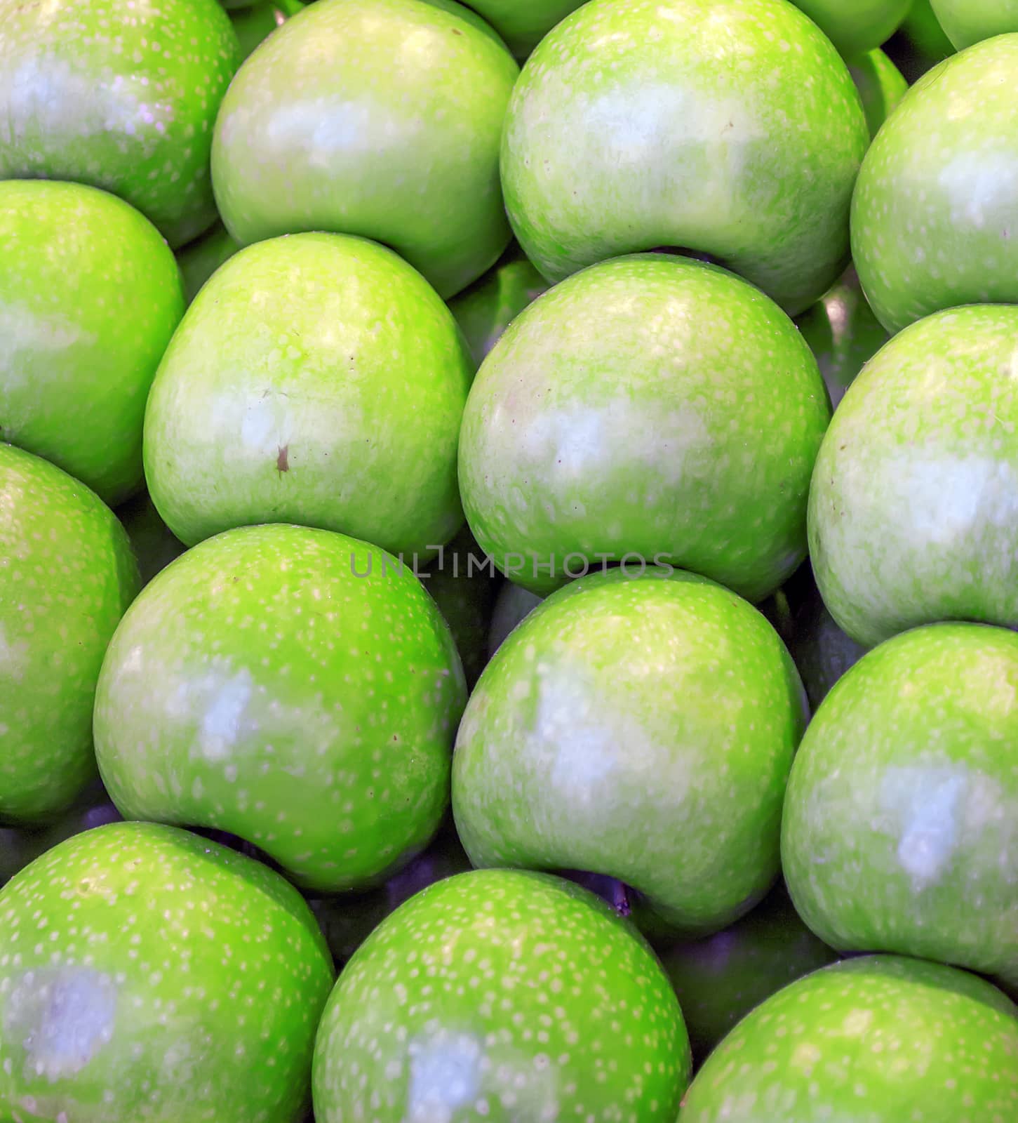 Bunch of green apples in a market