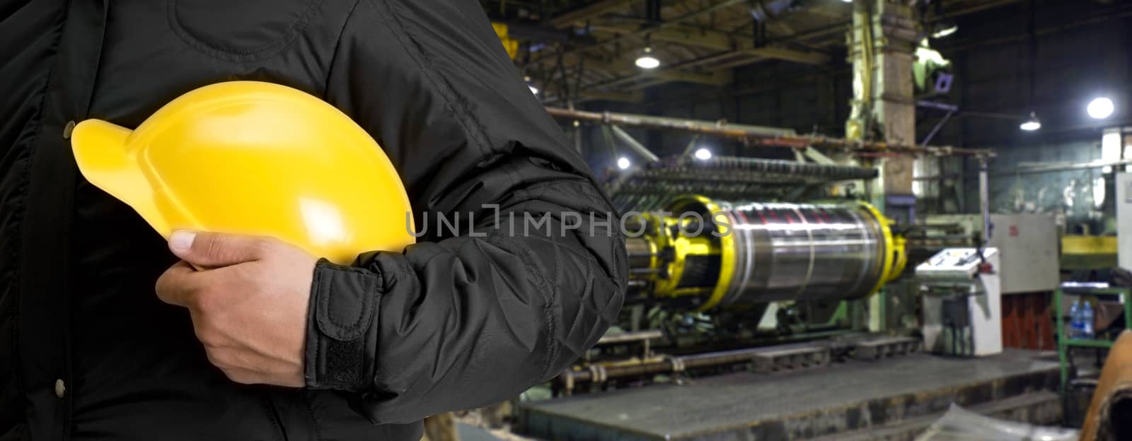 Worker with safety helmet at industrial factory