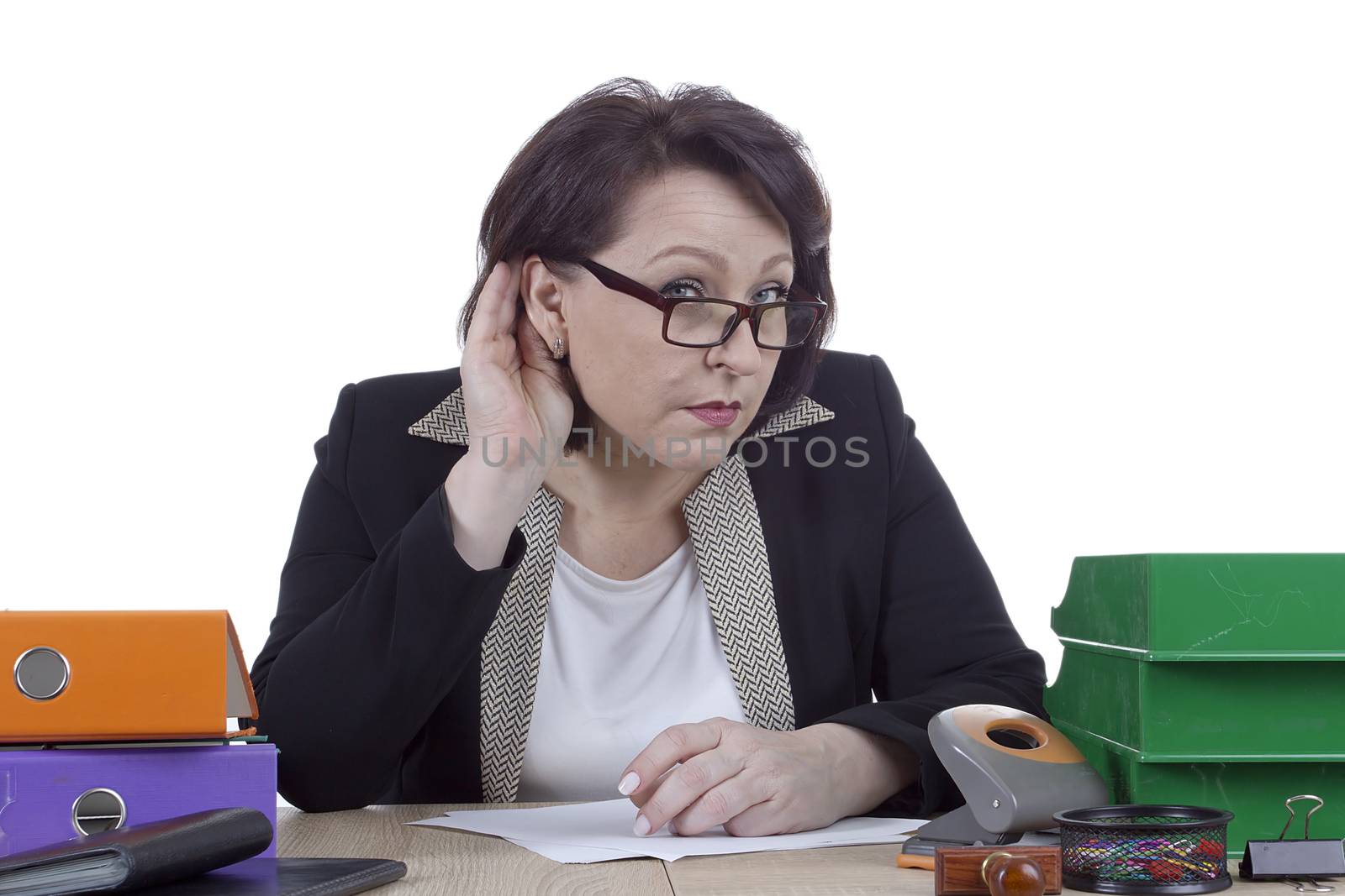 Business woman at the desk on a white background