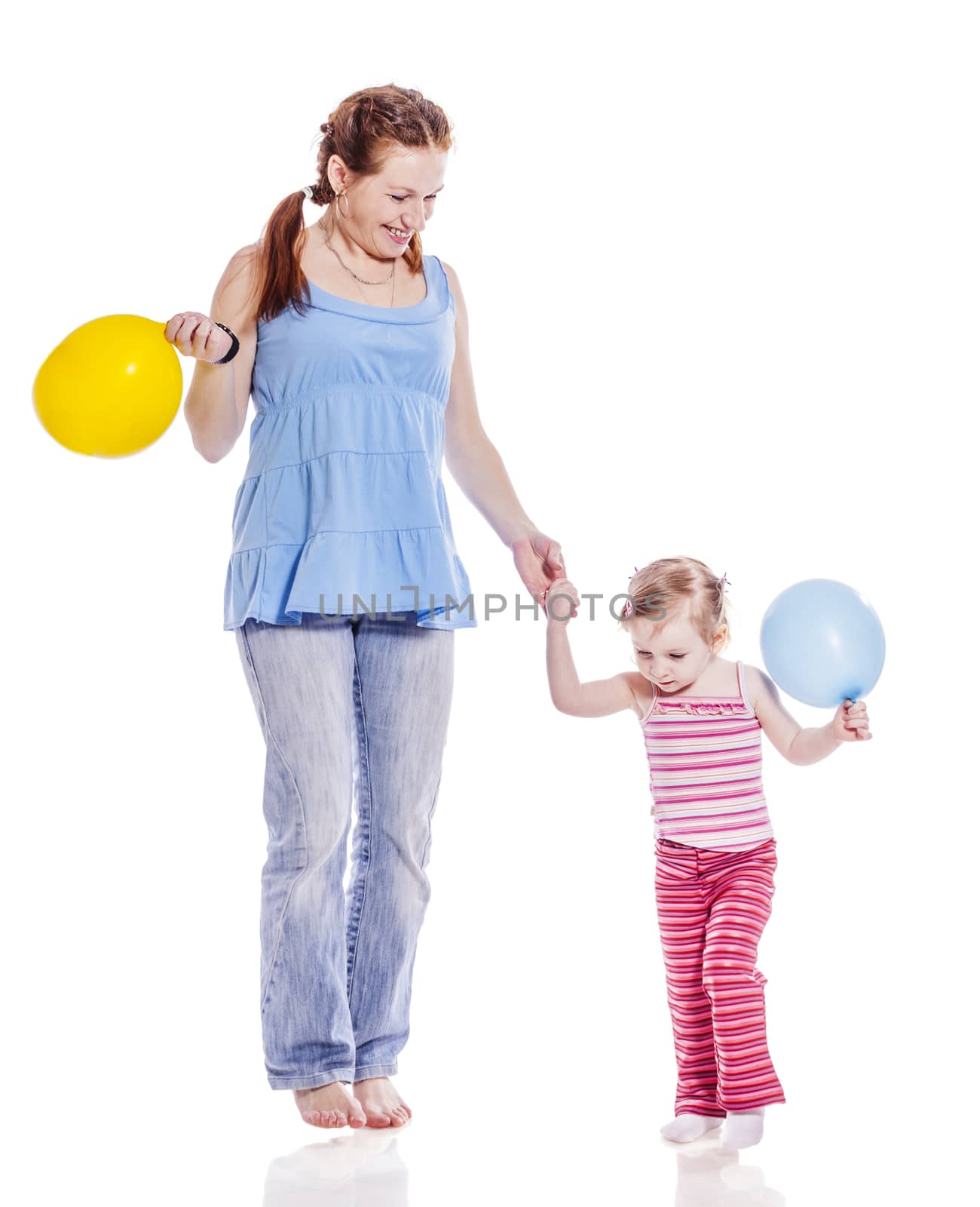 Mother walking with two years daughter isolated on white