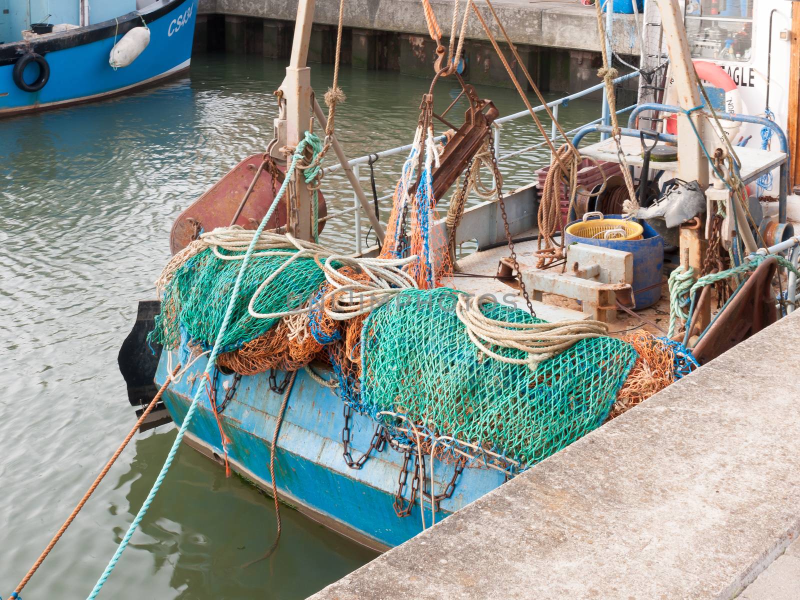 back of fishing boat with green fishing nets; Essex; England; UK