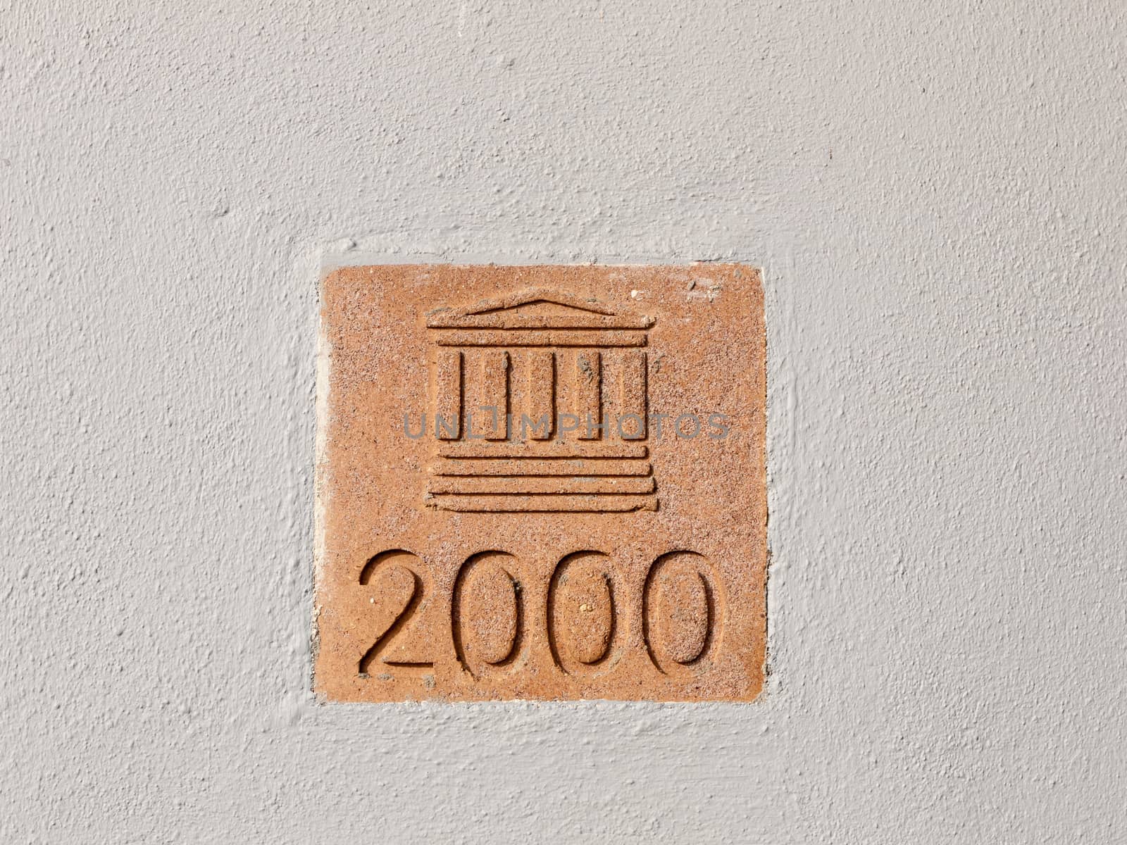 sign on wall outside 2000 column building plaque; Essex; England; UK