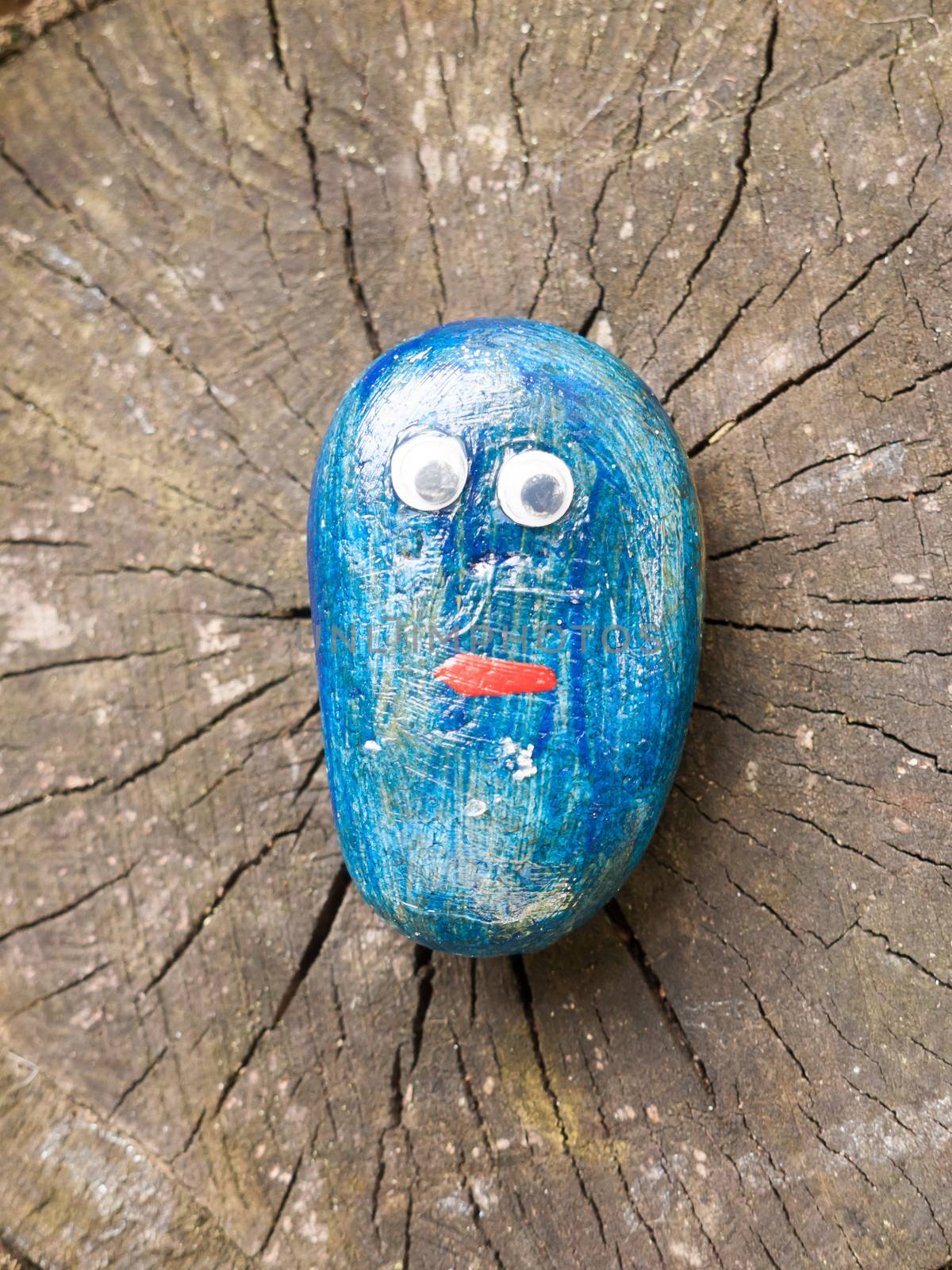 close up of funny cartoon painted children blue stone with eyes; Essex; England; UK