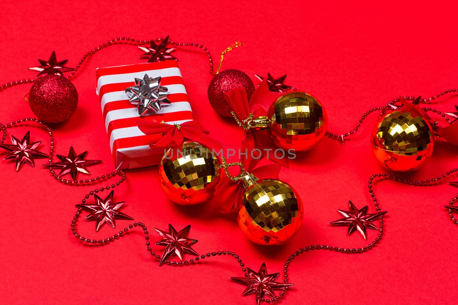 Christmas red background with gift and decoration by victosha