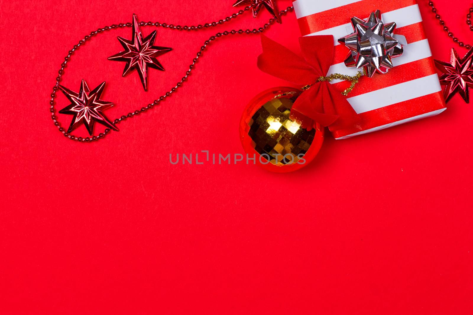 Christmas red background with gift and decoration by victosha