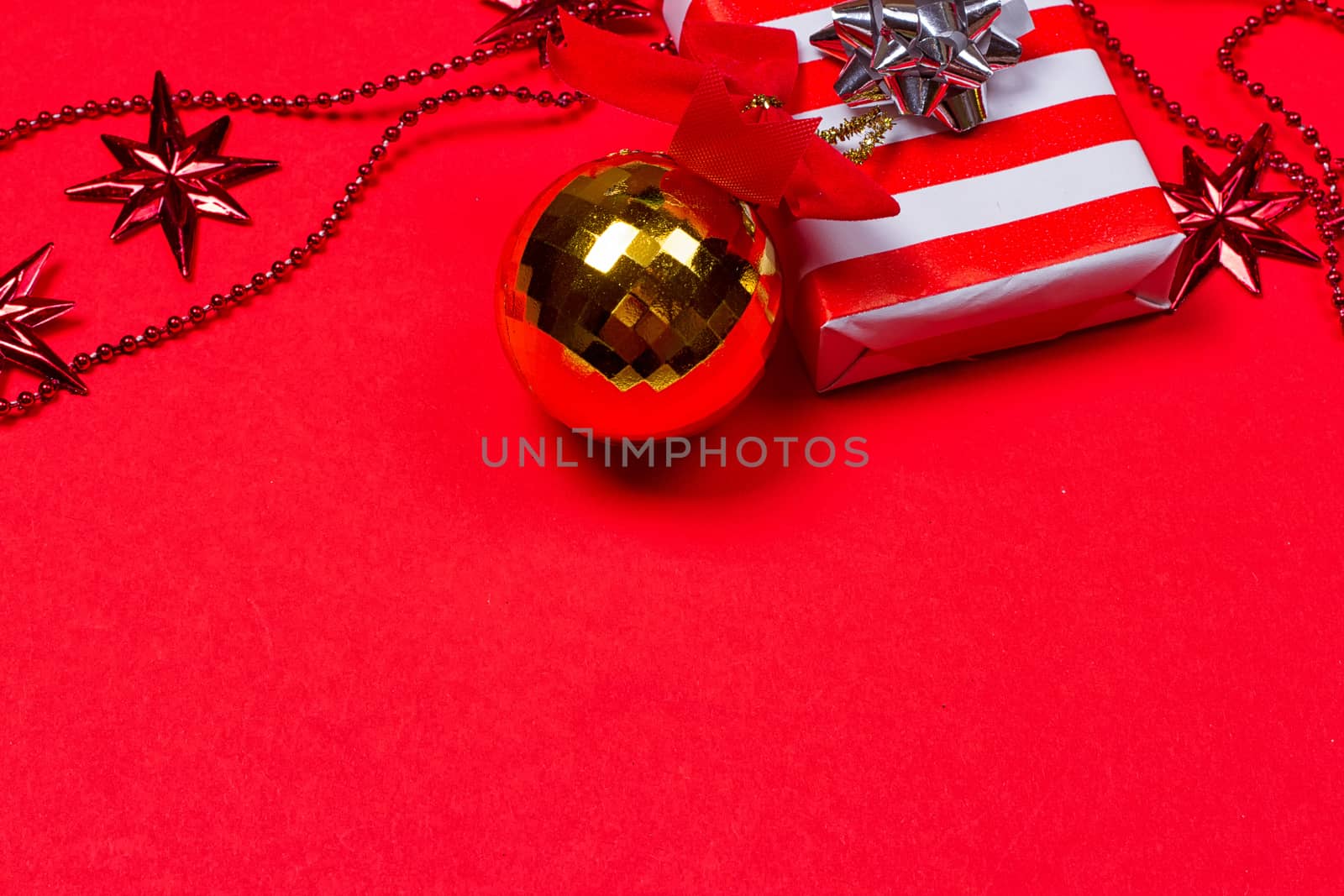 Christmas red background with gift and decoration by victosha