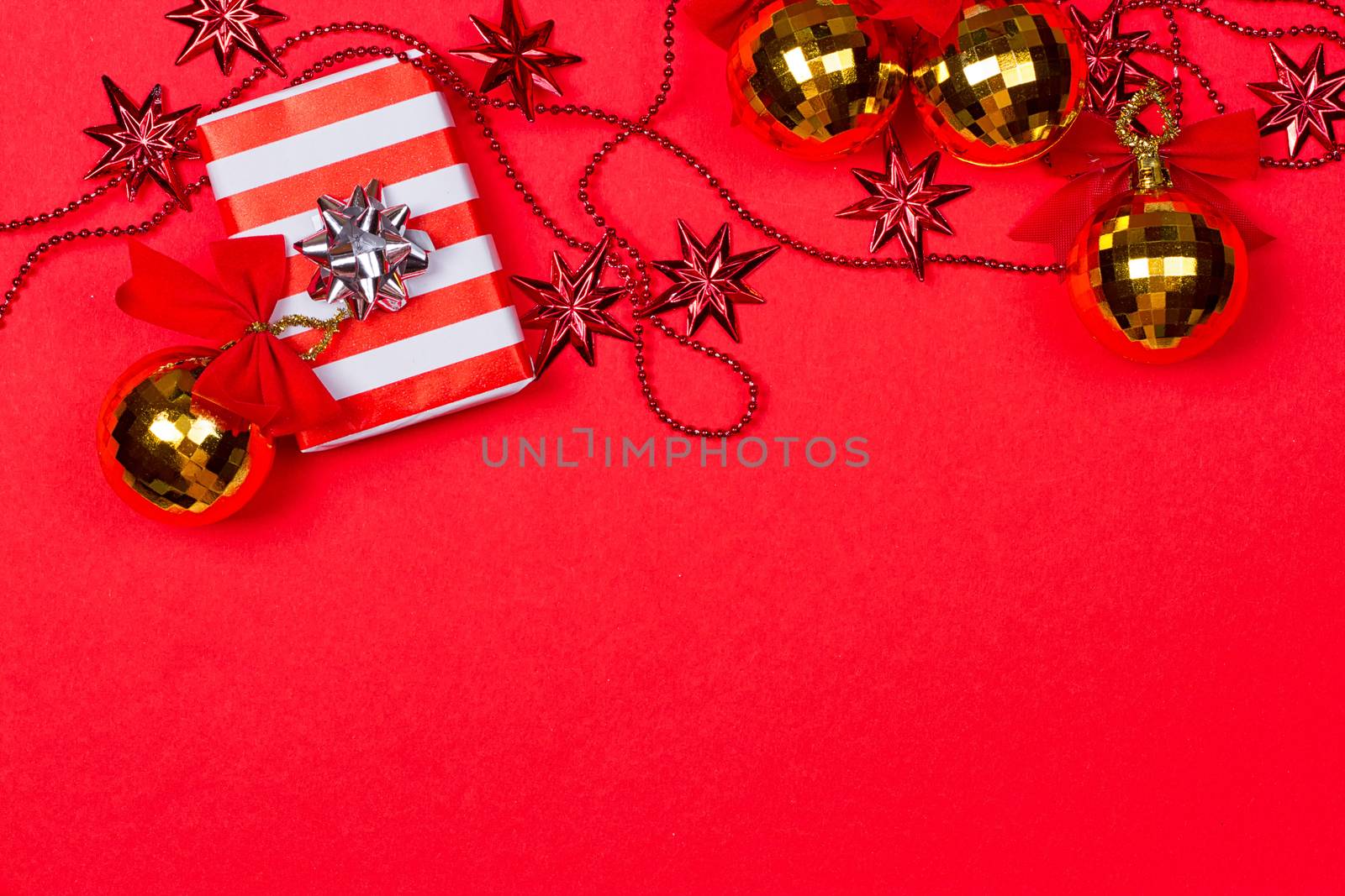 Christmas red background with gift and decoration by victosha