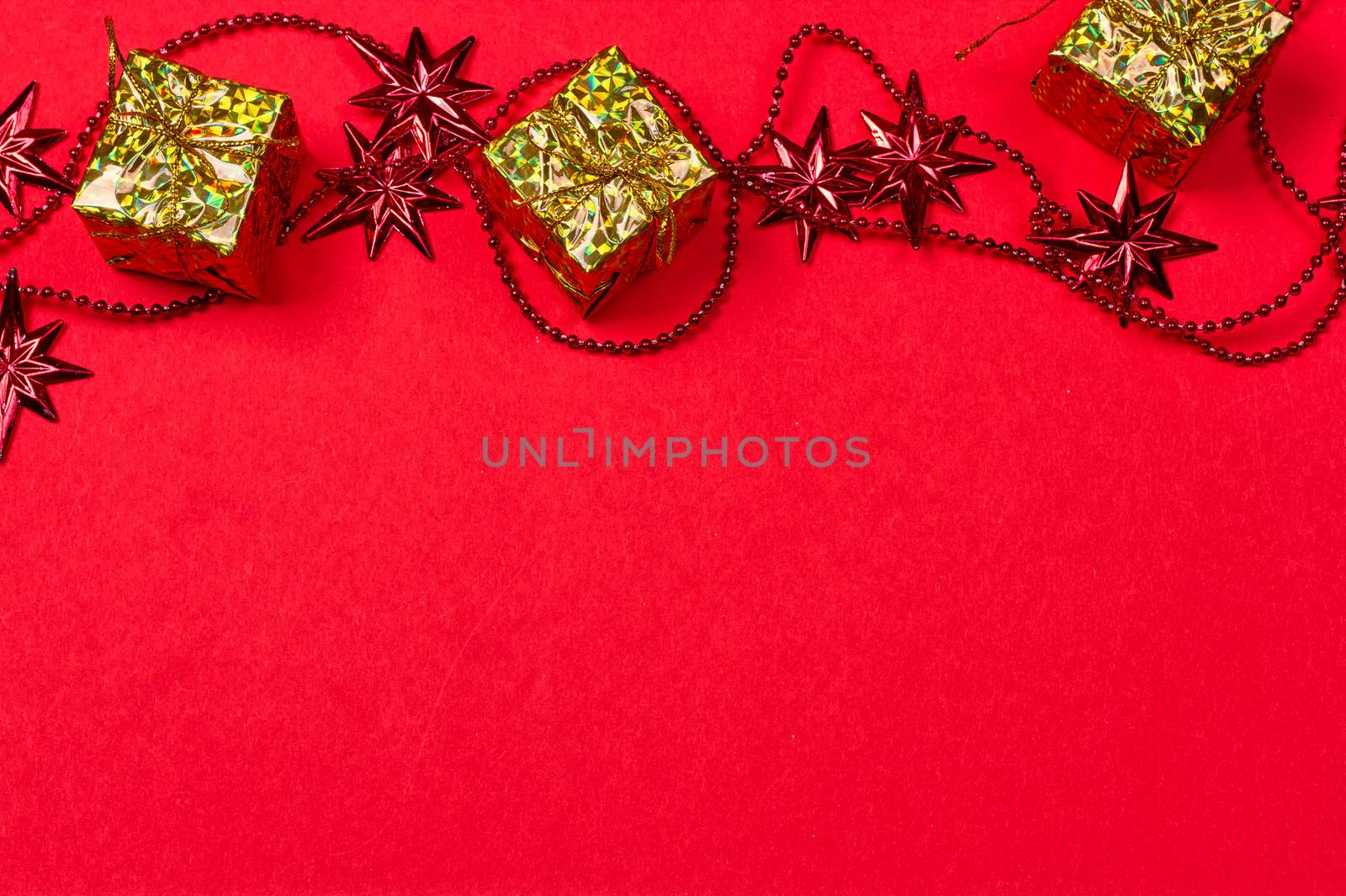 Christmas red background with gift and decoration by victosha