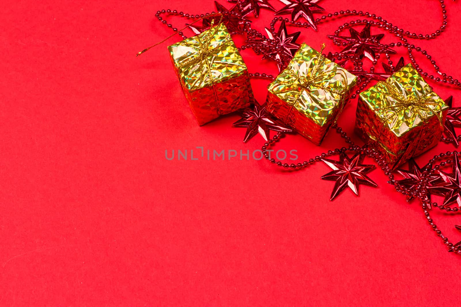 Christmas red background with gift and decoration on the red background