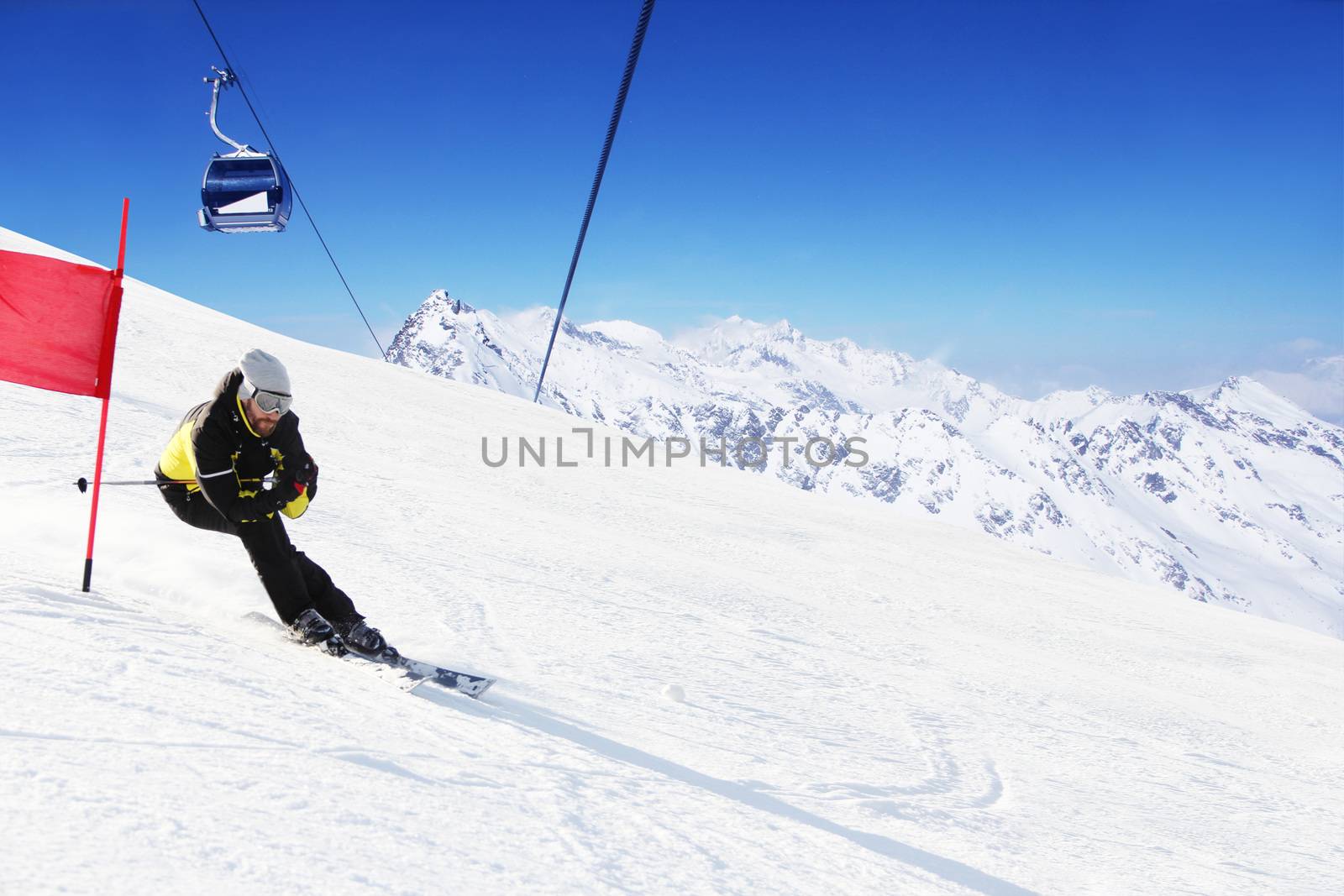 Giant Slalom ski racer skiing downhill in high mountains, Solden, Austria