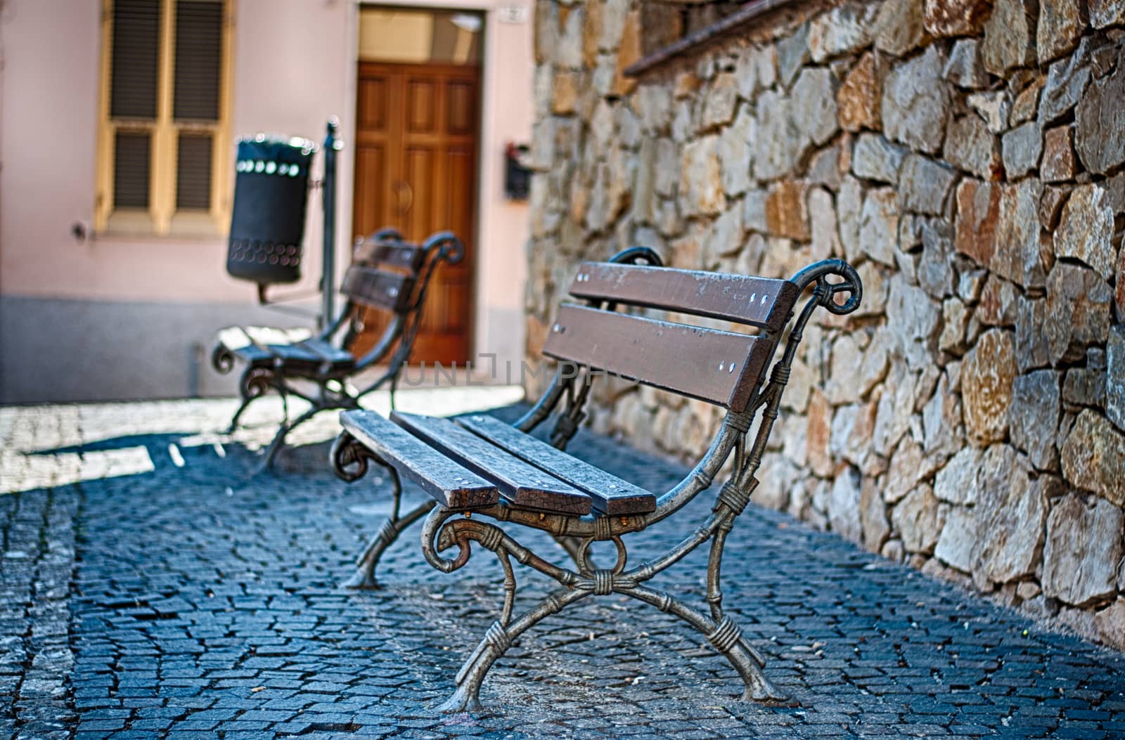 closeup of bench in a alley in sunny day