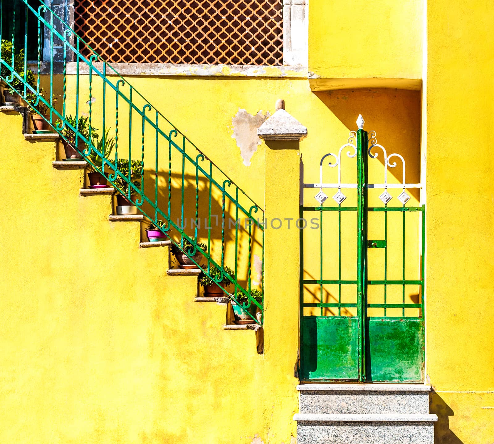 door and stairs on yellow wall by replica