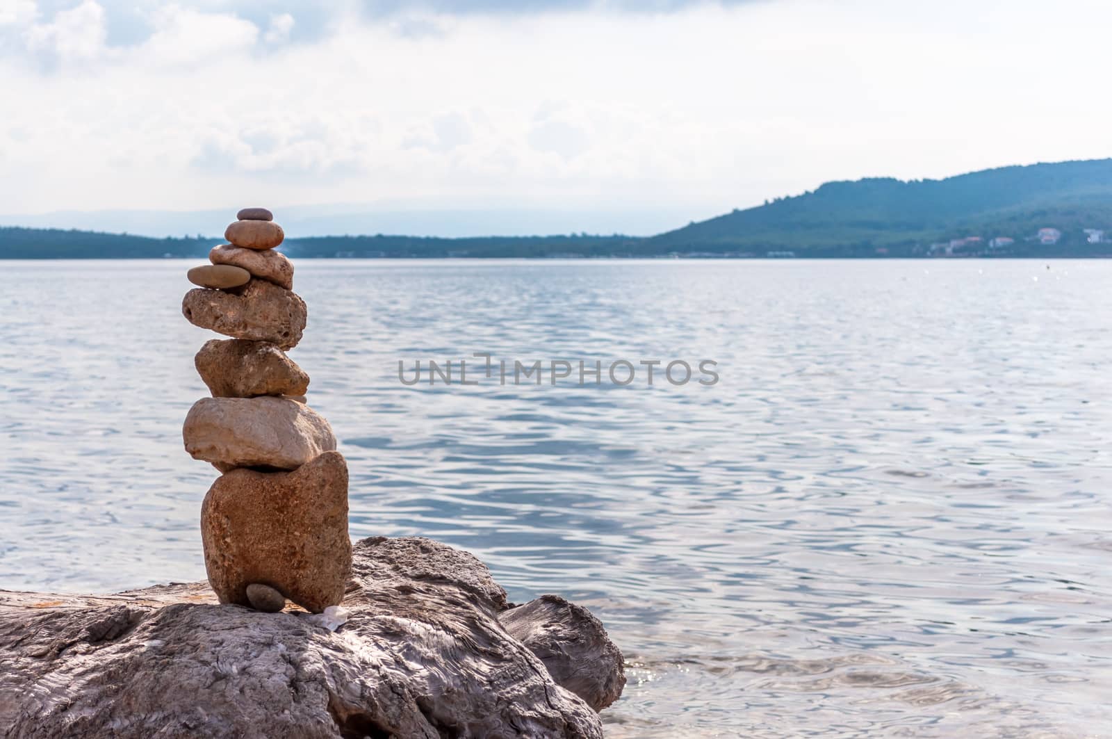 Pile of stones on the sea in a sunny day of autumn