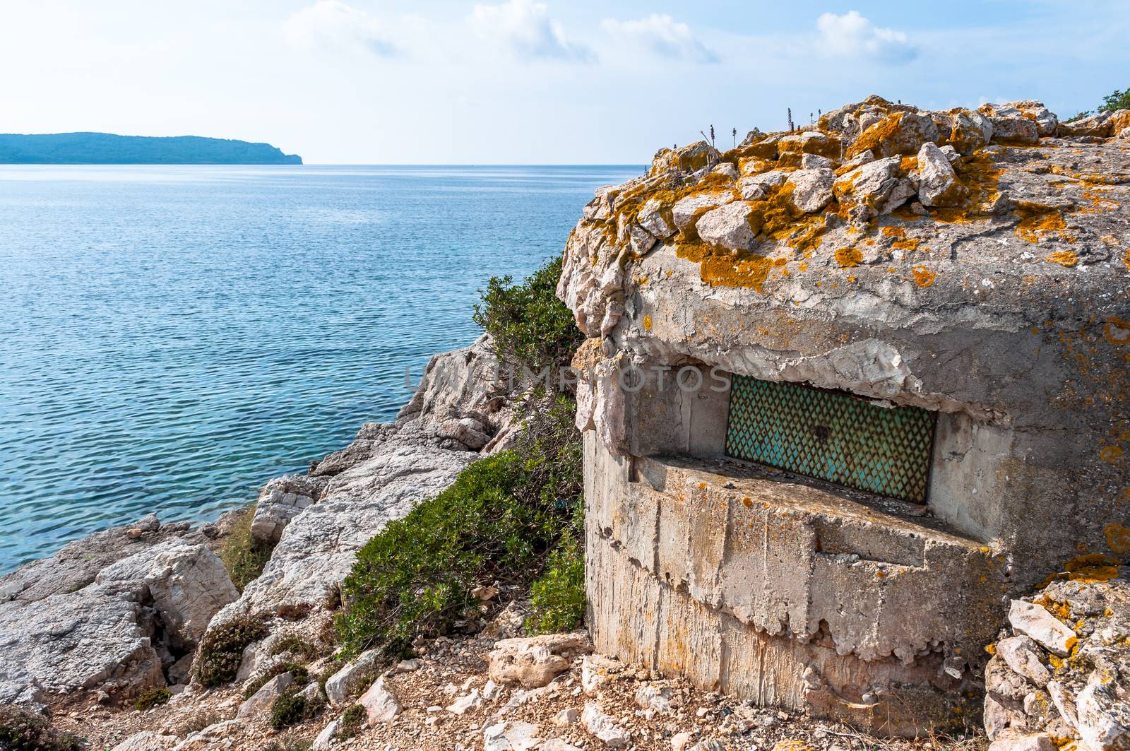 World war two bunker on Sardinia's coast in a cloudy day