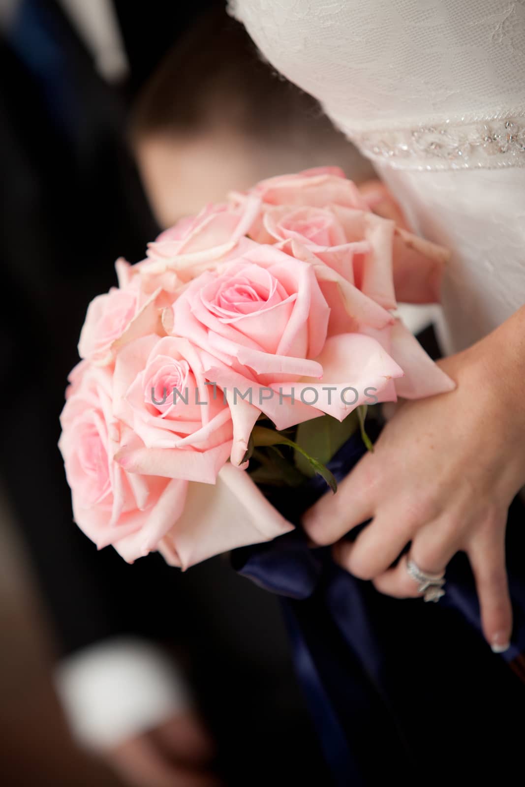 Closeup of Bride Holding Pink Bouquet