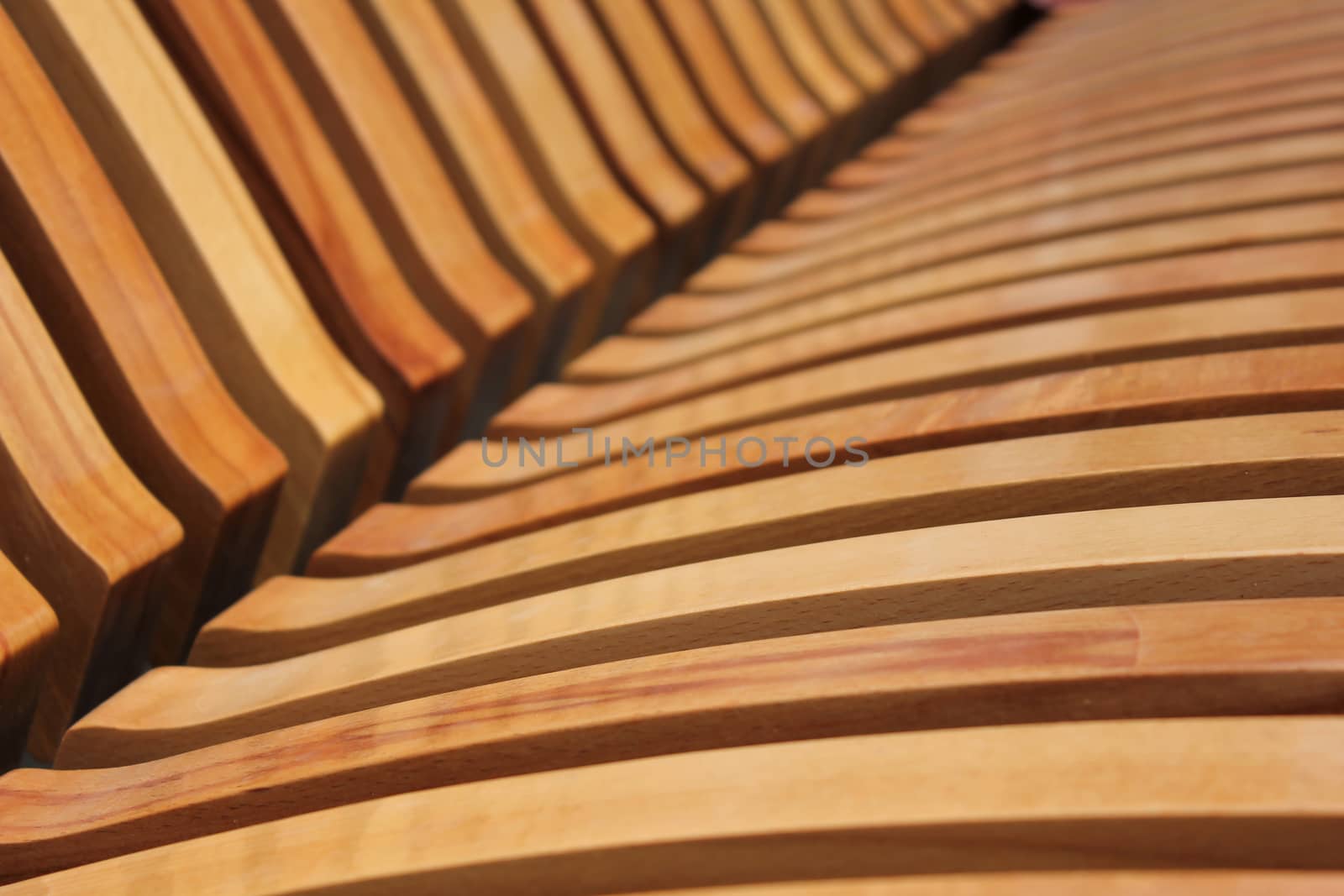 Wooden laths on a seat mat and on a back of a city shop