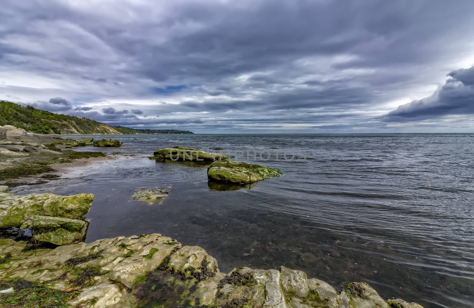 rocks and stormy clouds by EdVal