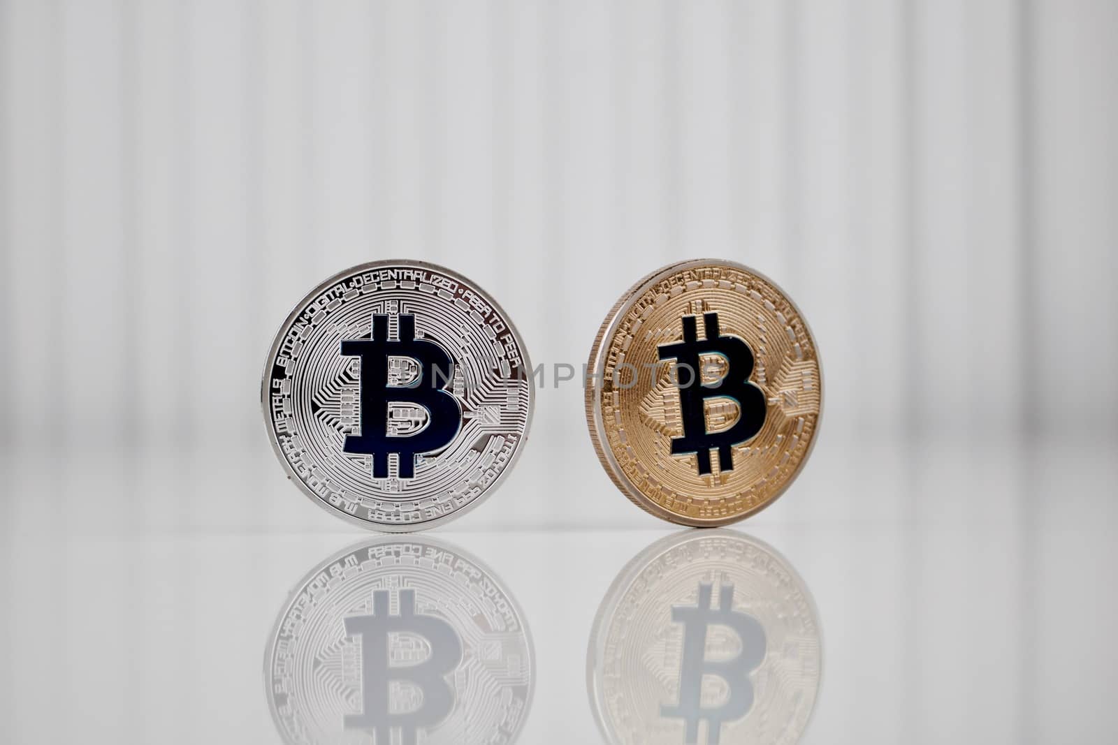 Digital currency physical silver and gold bitcoin coin.