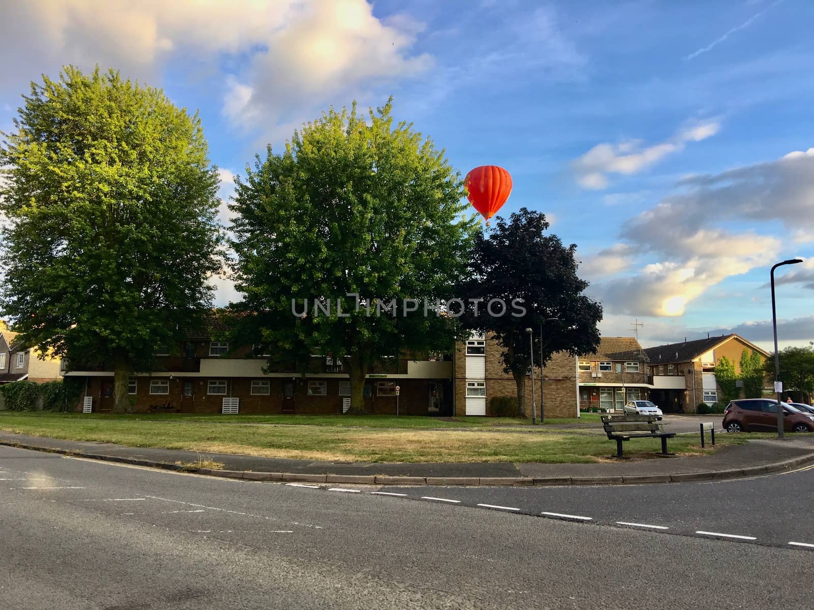 Big red balloon over the buildings in Newport Pagnel. Bedfordshire, England.