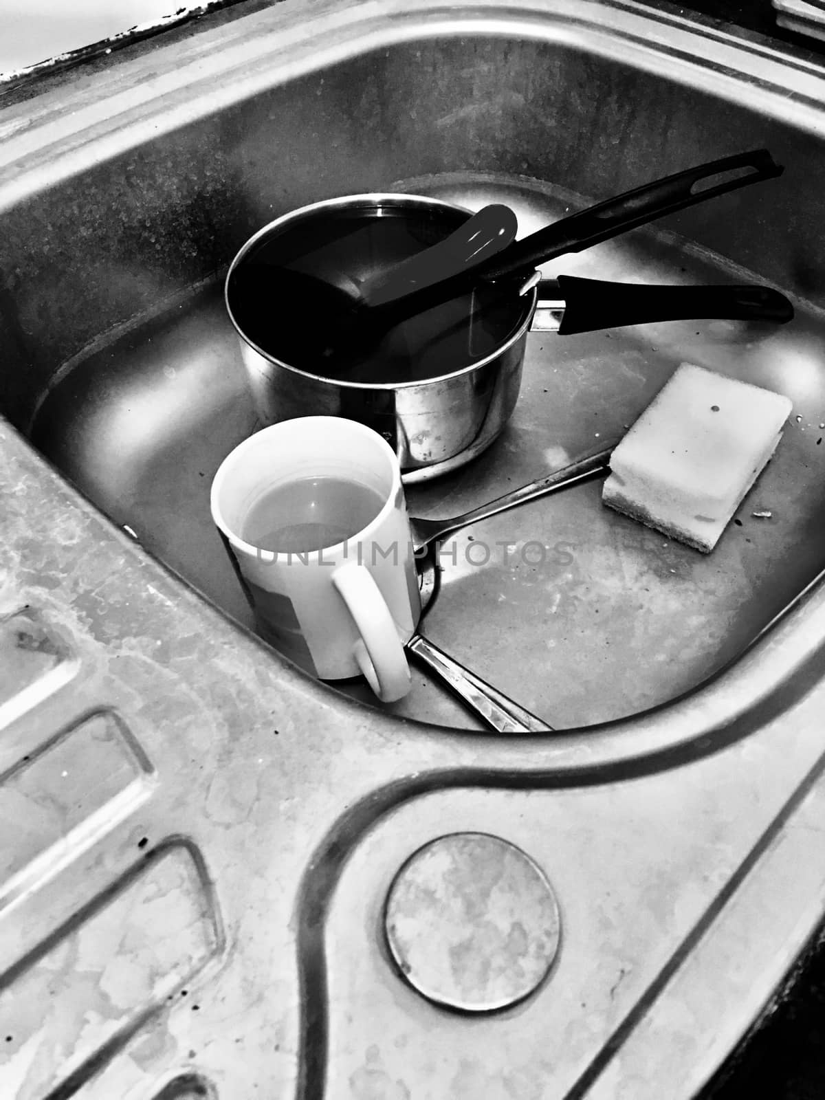 Mug, cutlery and dirty kitchen in black and white scene. Rubbish concept.